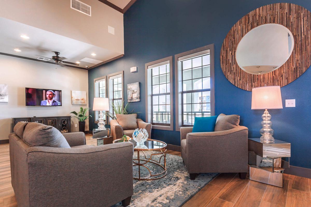 a living room filled with furniture and a large window