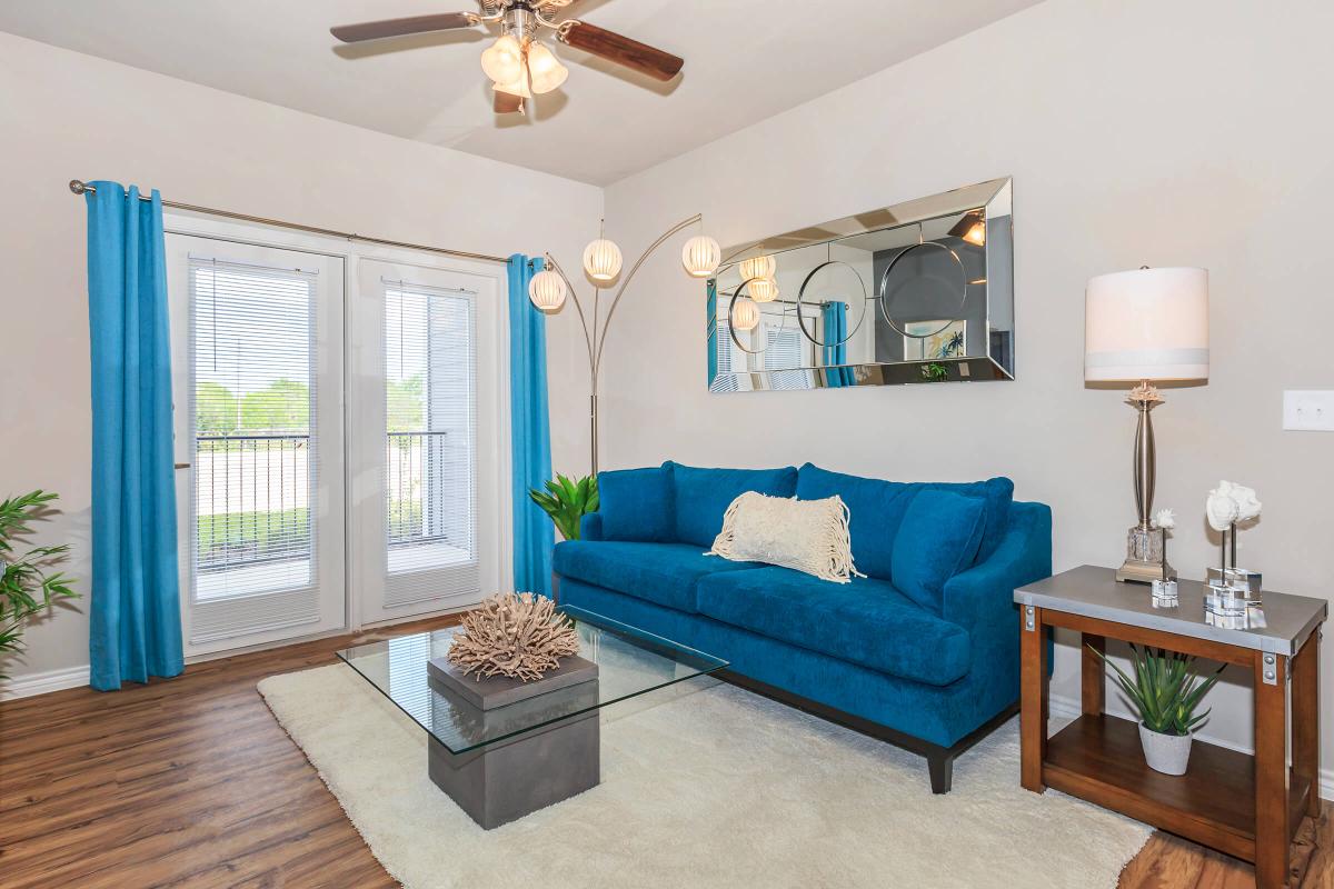 a bedroom with a view of a living room