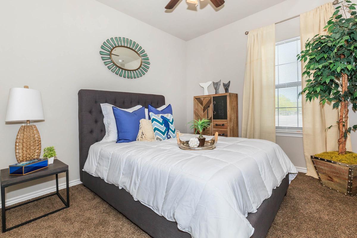 a bedroom with a bed in a hotel room