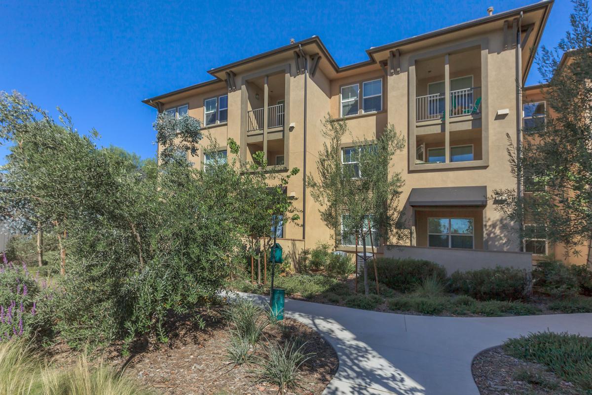 La Verne Village Luxury Apartment Homes community building with green landscaping