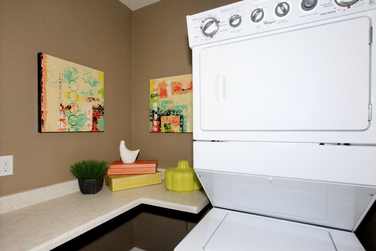 Stacked washer and dryer in laundry room