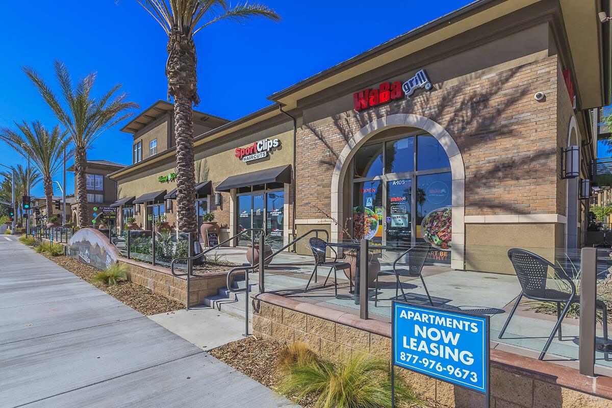 La Verne Village Luxury Apartment Homes & Shops with tables and chairs outside