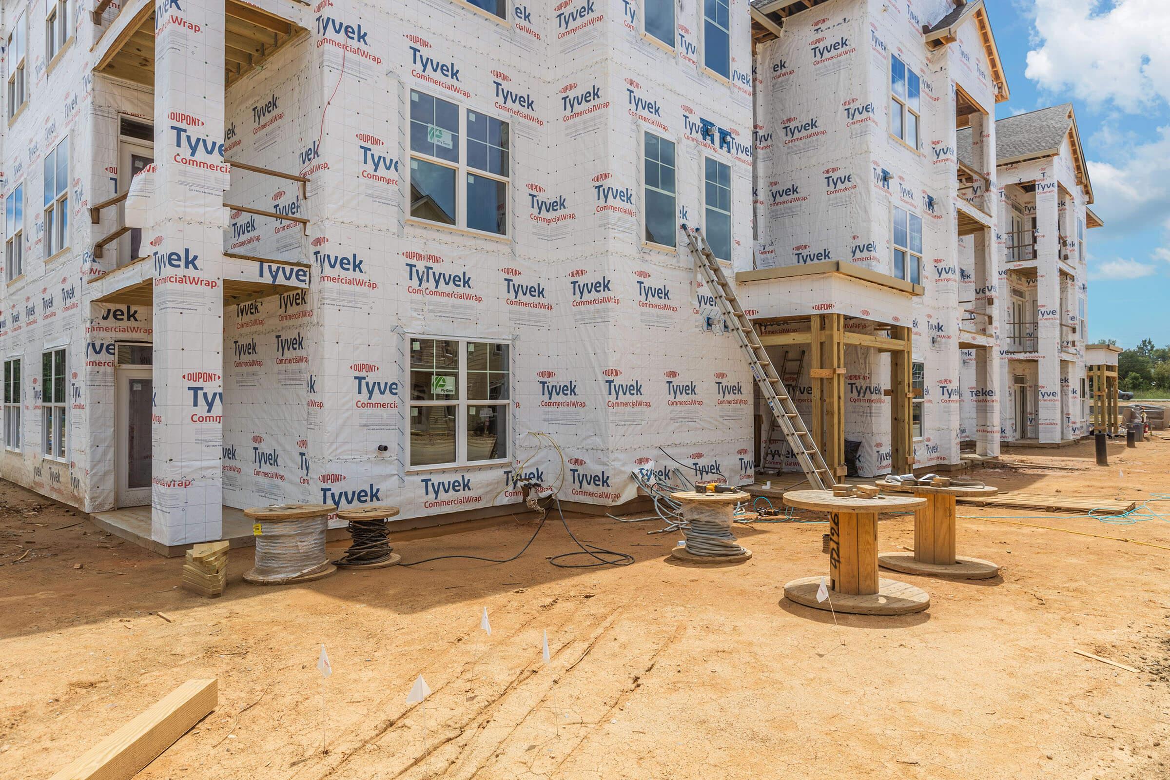 a pile of dirt in front of a building