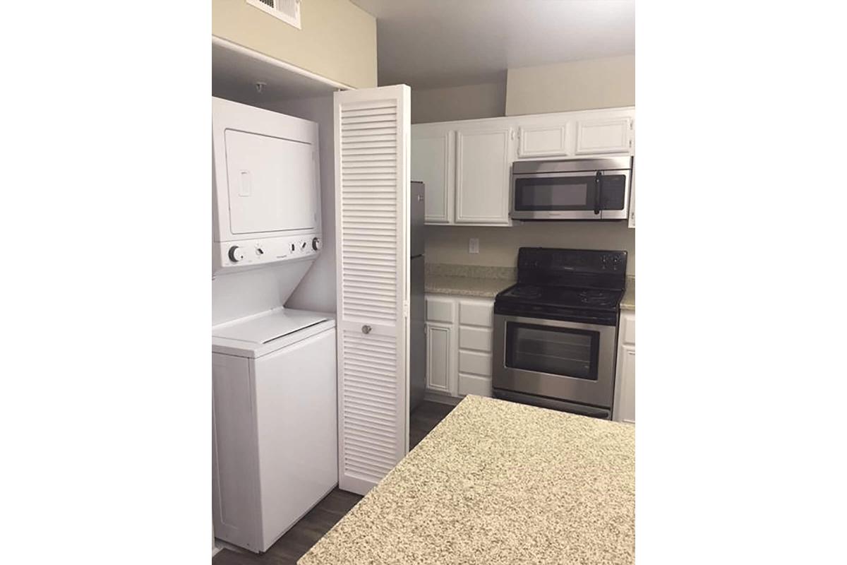 Kitchen with stackable washer and dryer