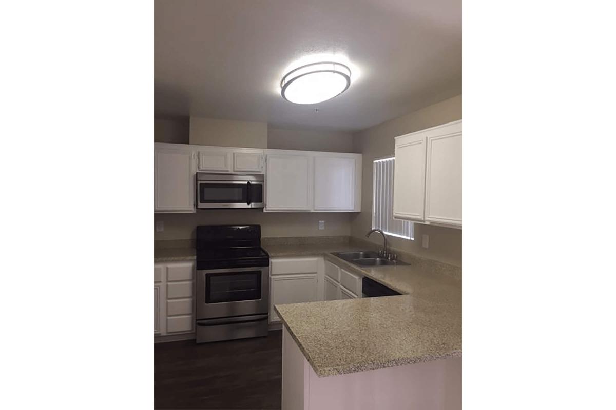 Kitchen with tan countertops