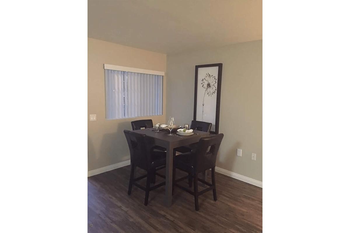 Furnished dining room with a wooden table