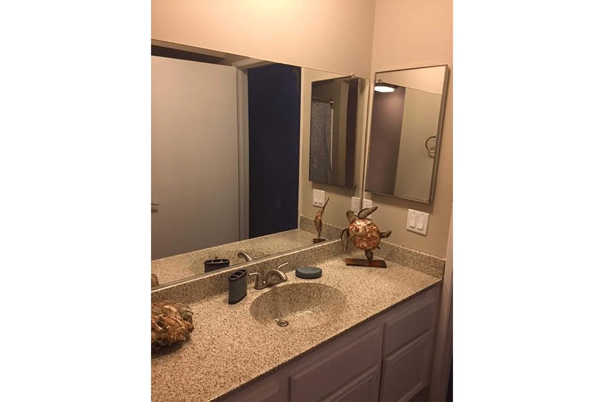 Bathroom with white cabinets