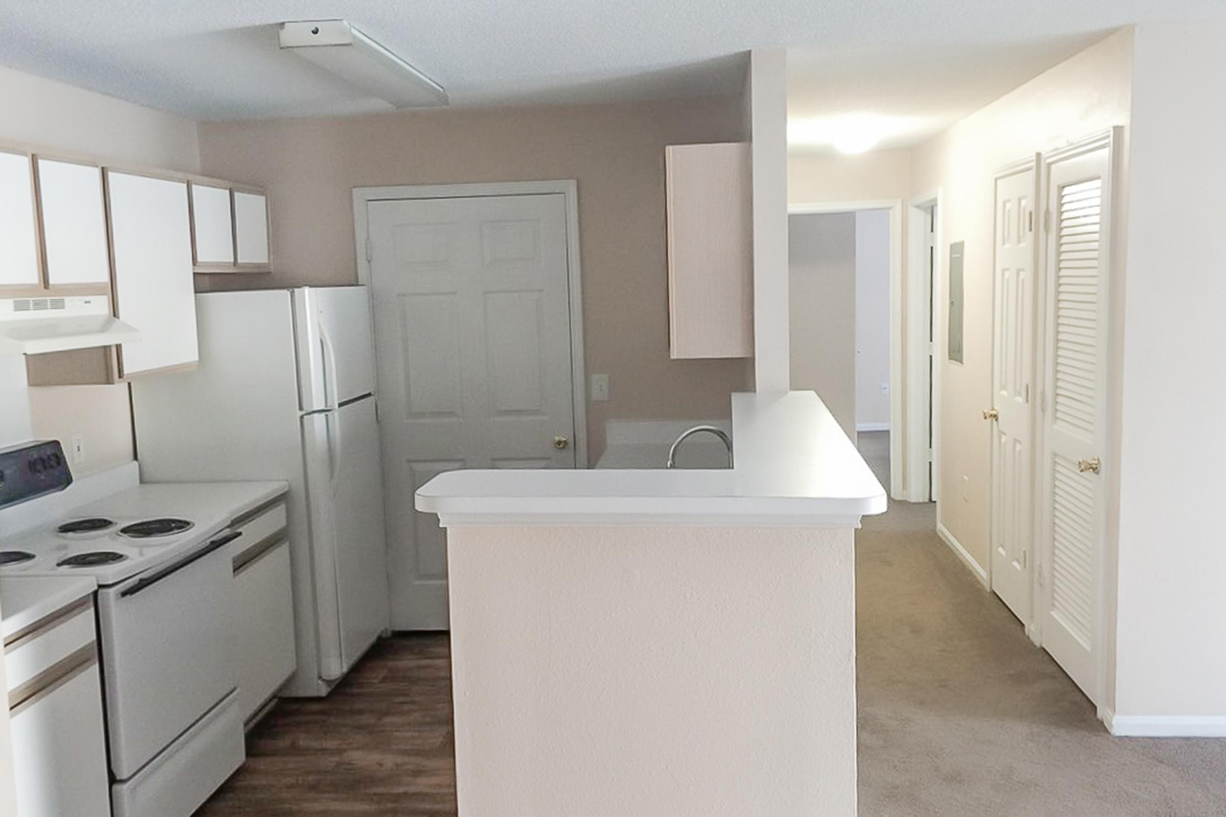 a large white refrigerator in a kitchen