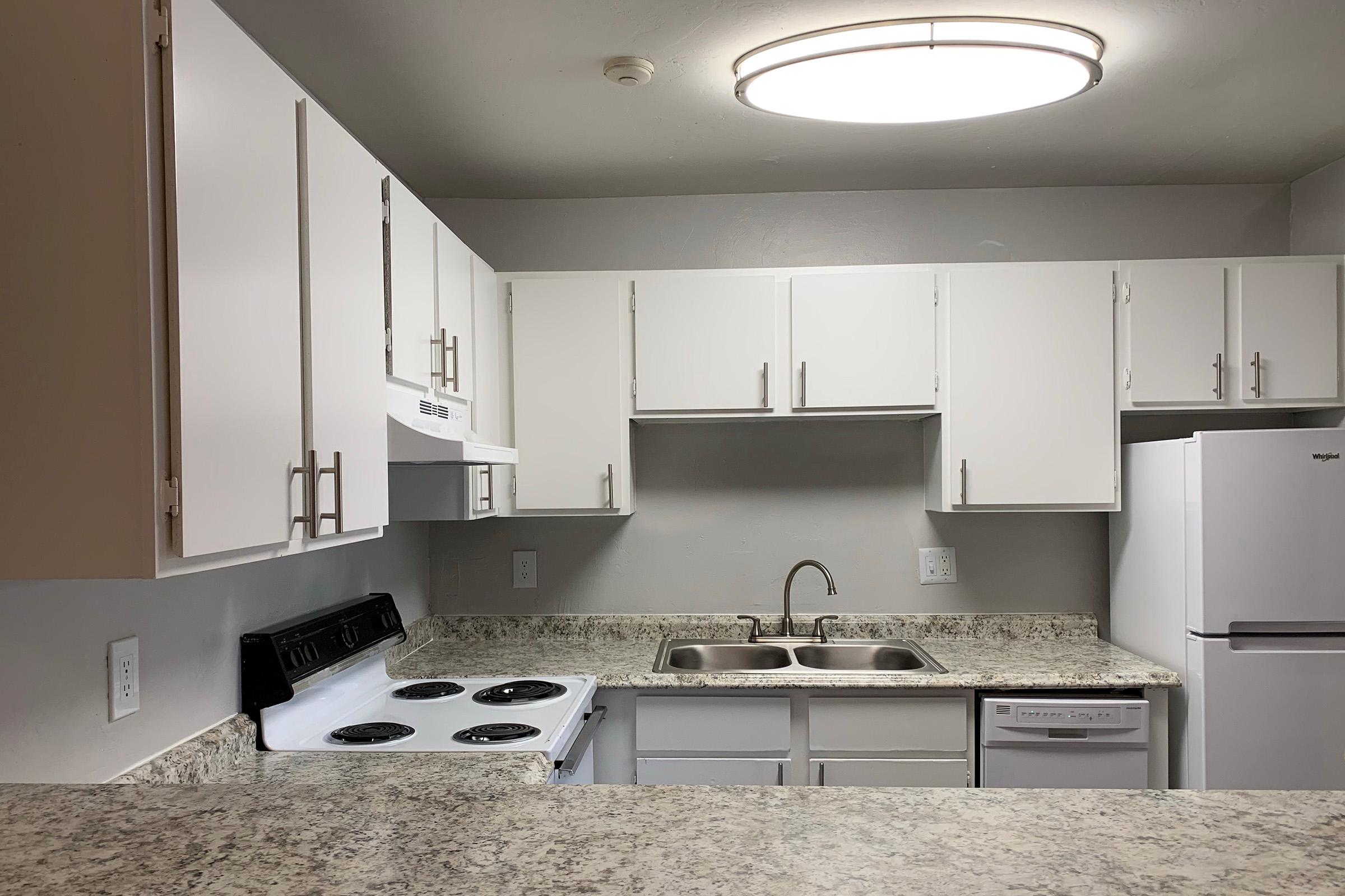 a kitchen with a sink and a microwave