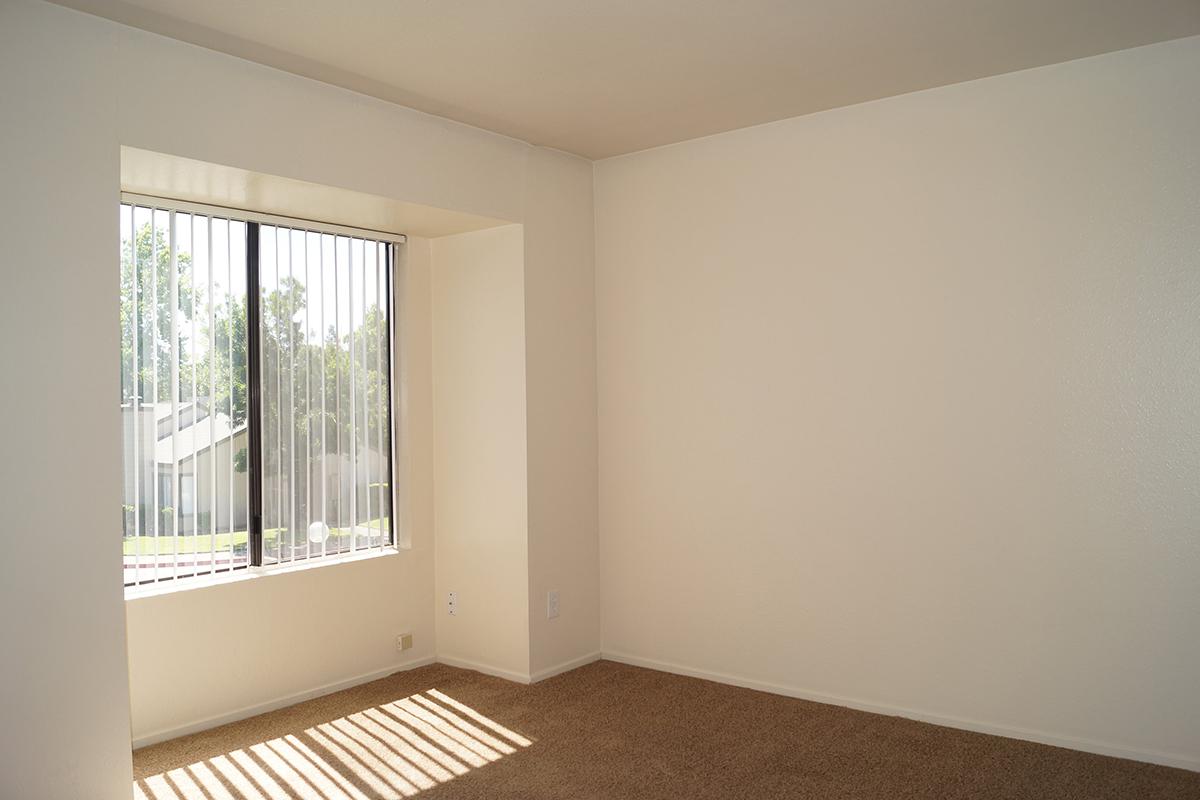 a bedroom with a large window