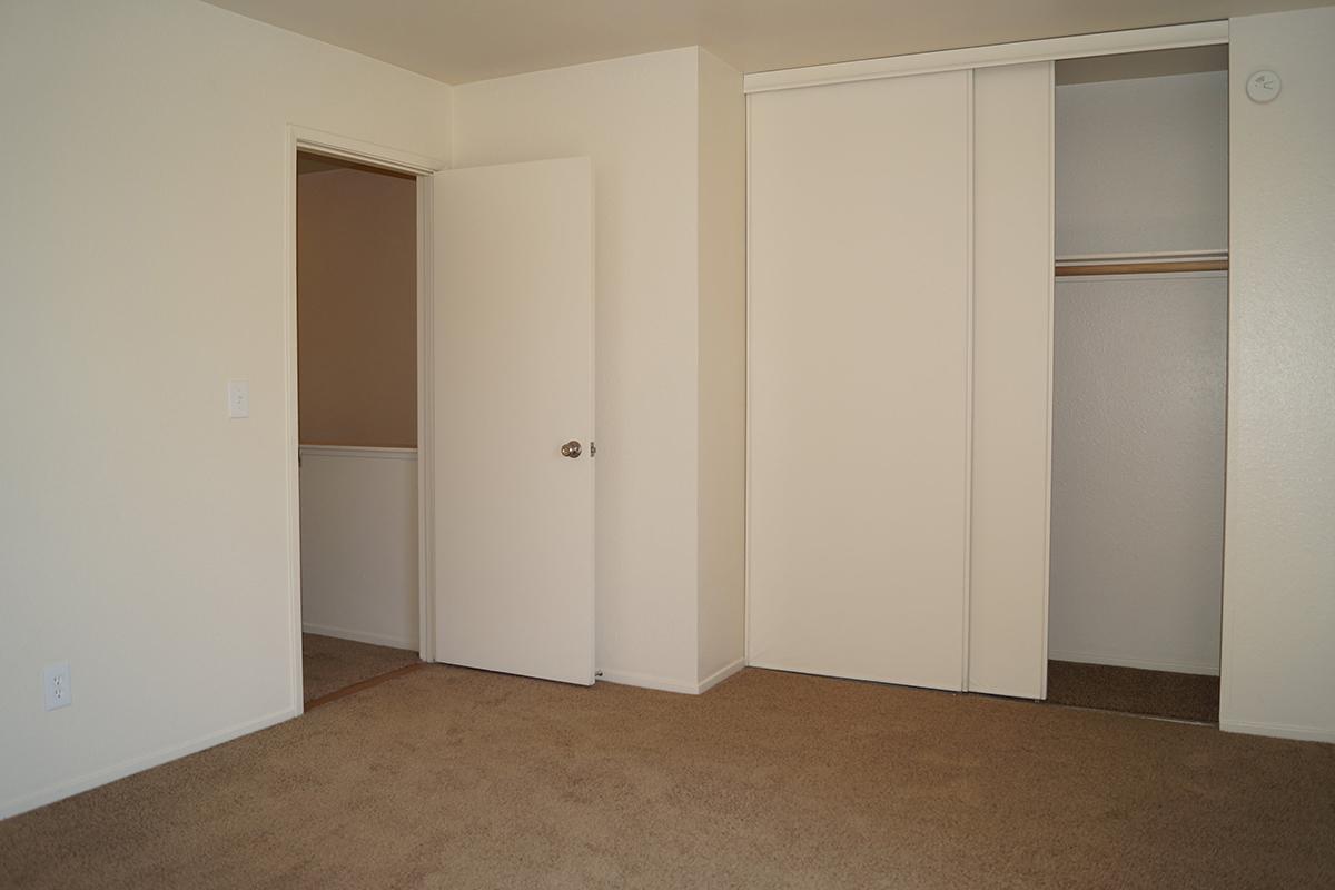 a white refrigerator freezer sitting inside of a building