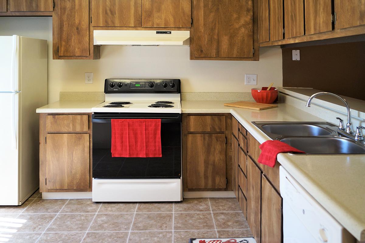 a kitchen with a stove top oven sitting inside of a refrigerator