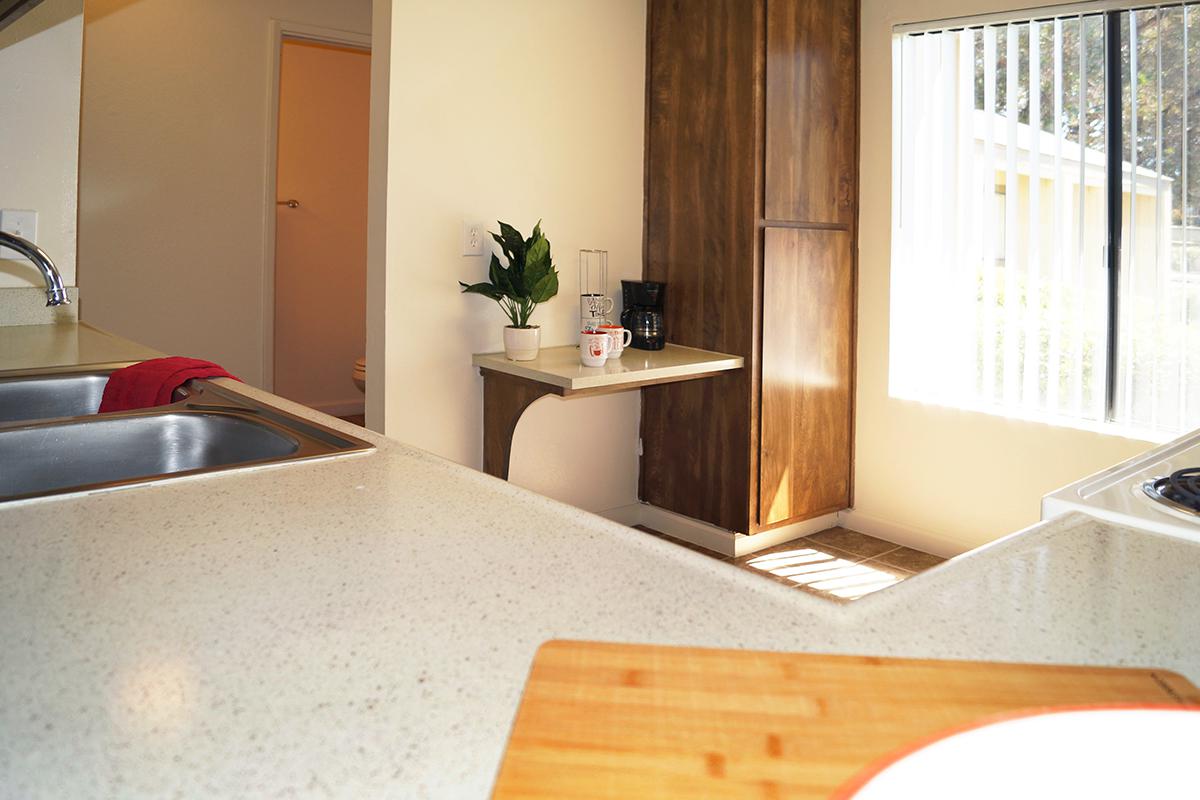 a kitchen with a sink and a window