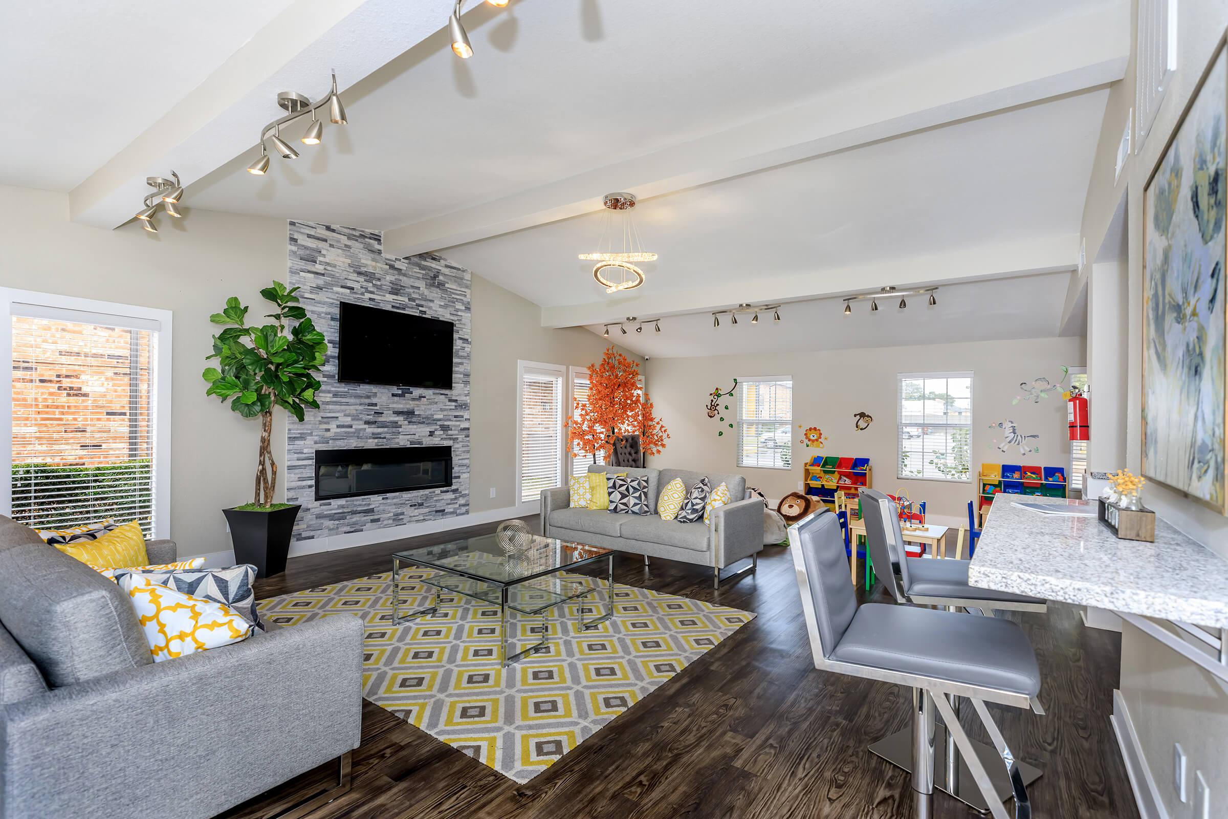 a living room filled with furniture and a fireplace