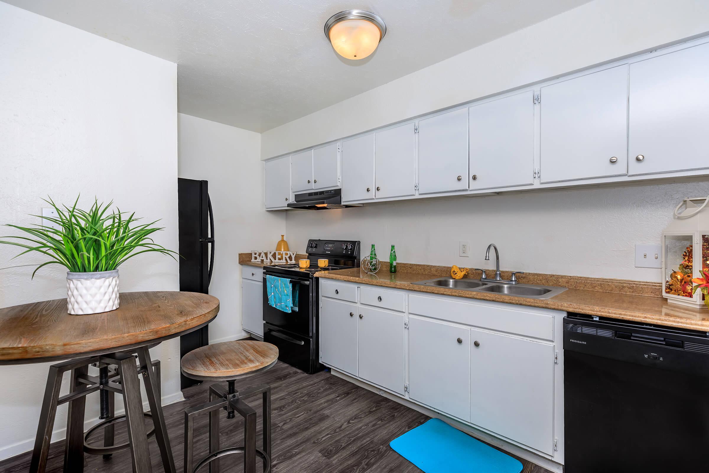 a kitchen with an island in the middle of a room