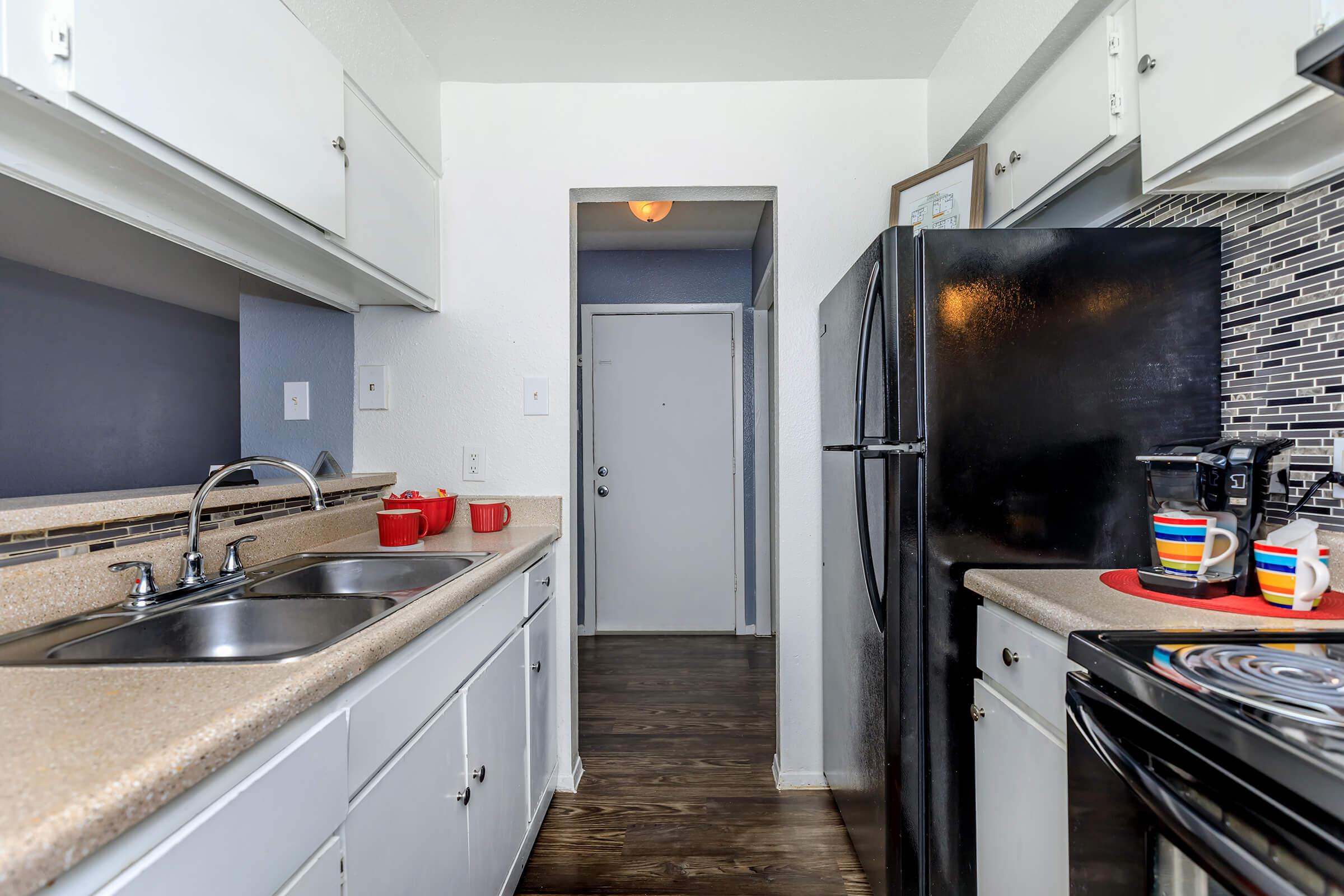 a large kitchen with stainless steel appliances