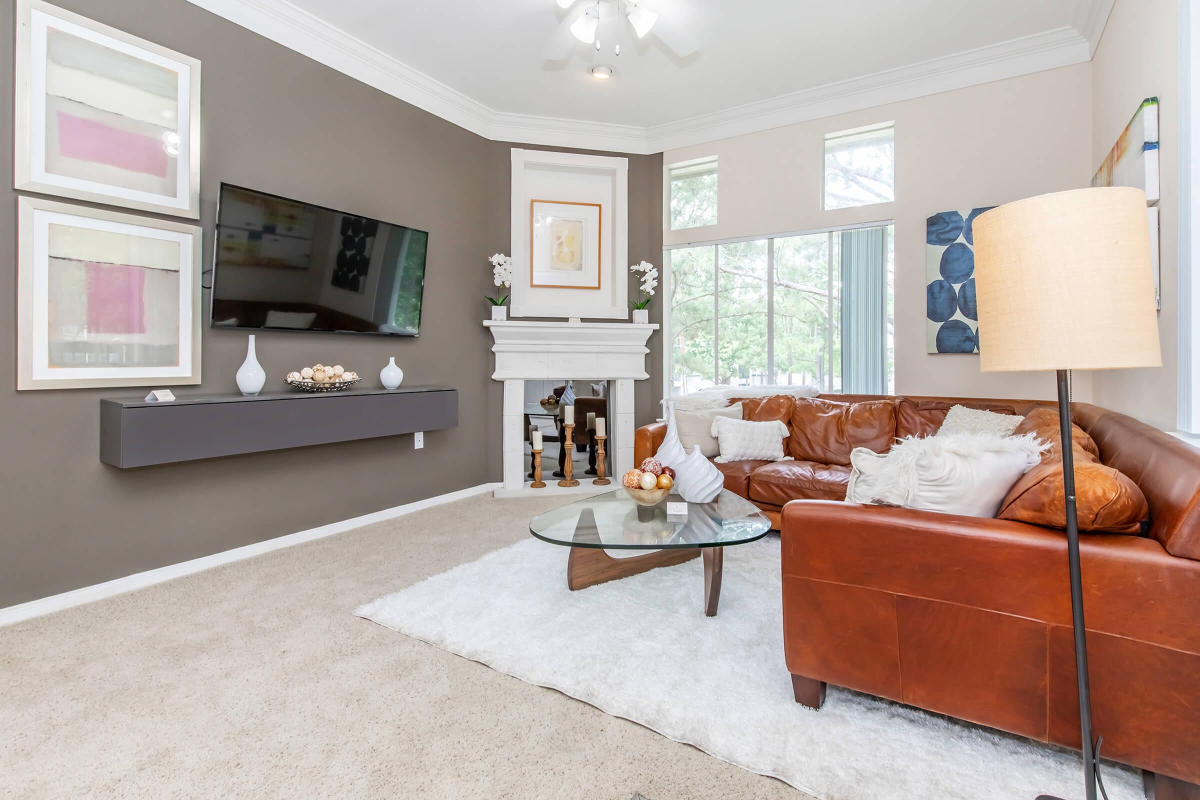 a room filled with furniture and a large window