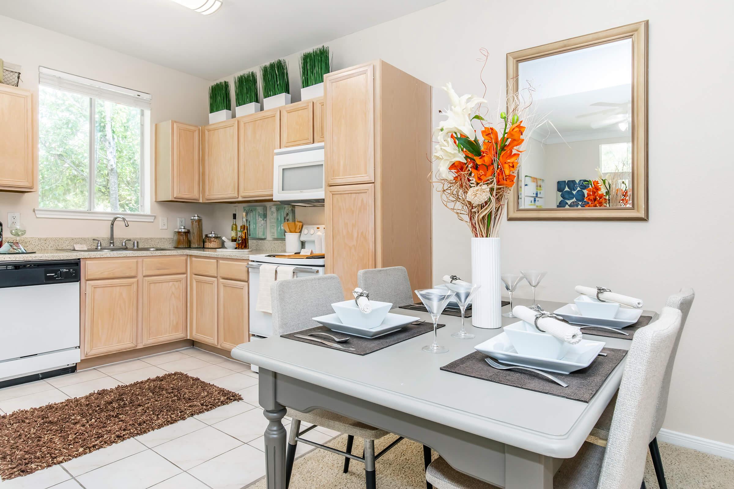 a kitchen with a table in a room