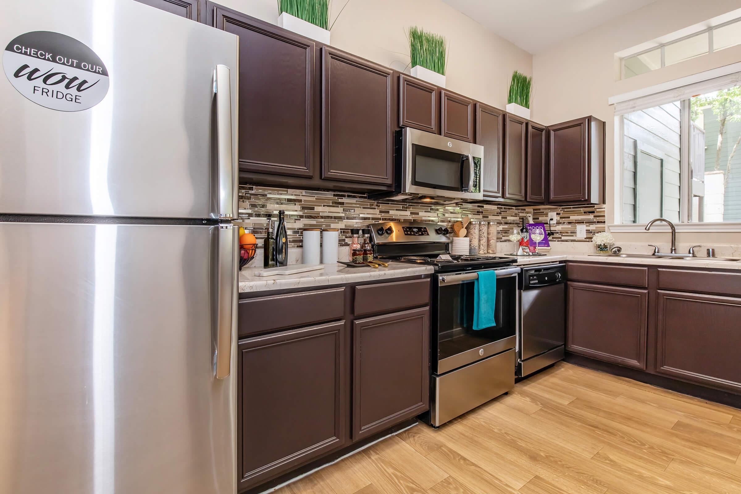 a stainless steel refrigerator in a kitchen