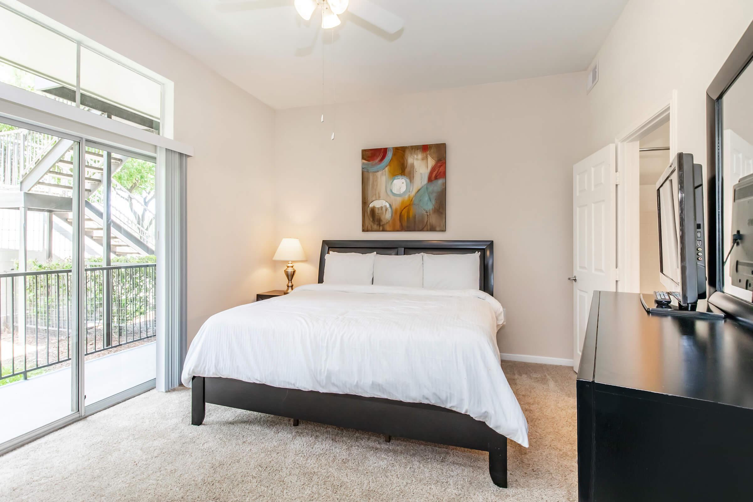 a bedroom with a large bed in a room