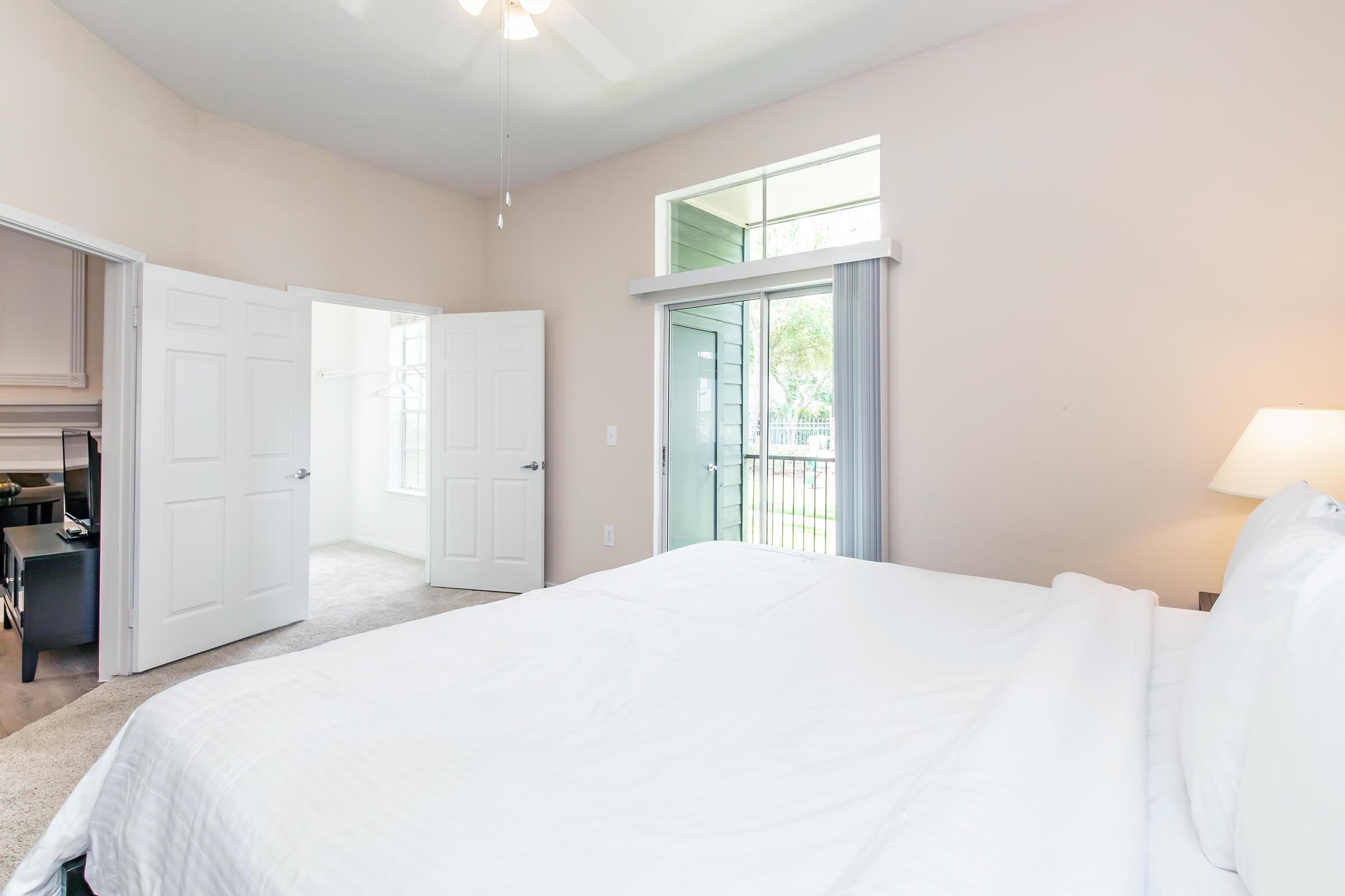 a bedroom with a large bed in a room