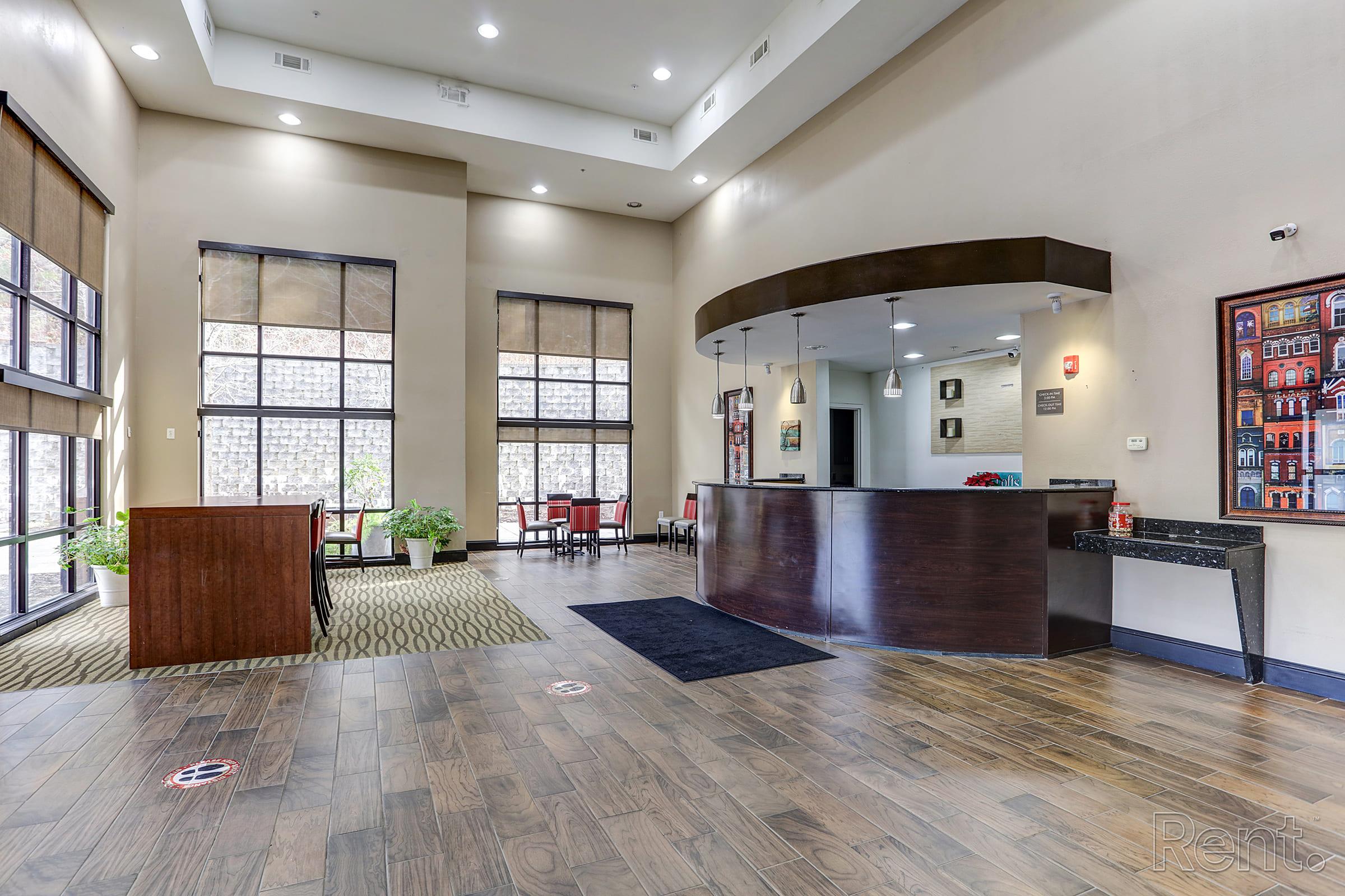 a room filled with furniture and a large window