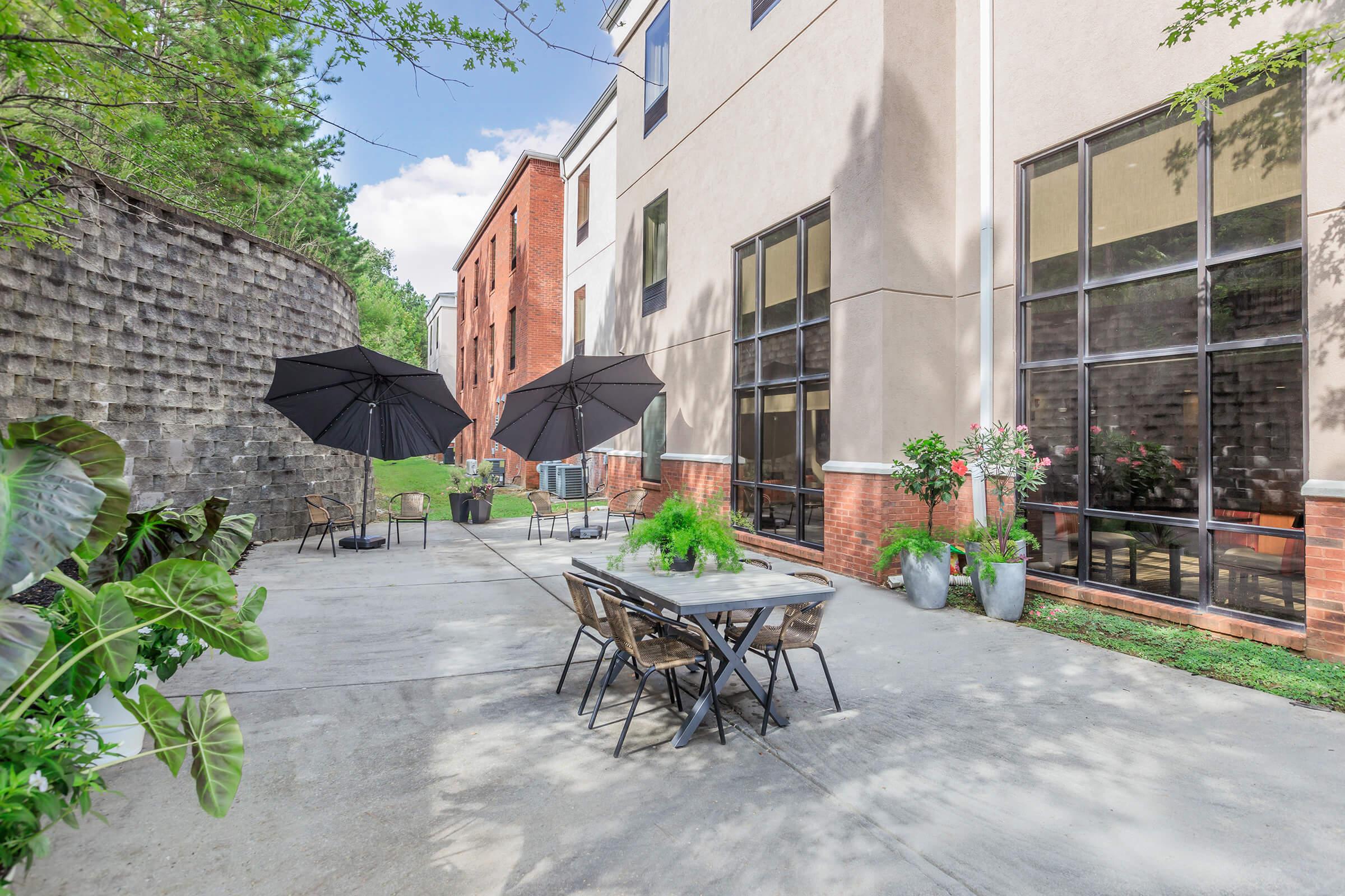 a bench in front of a brick building