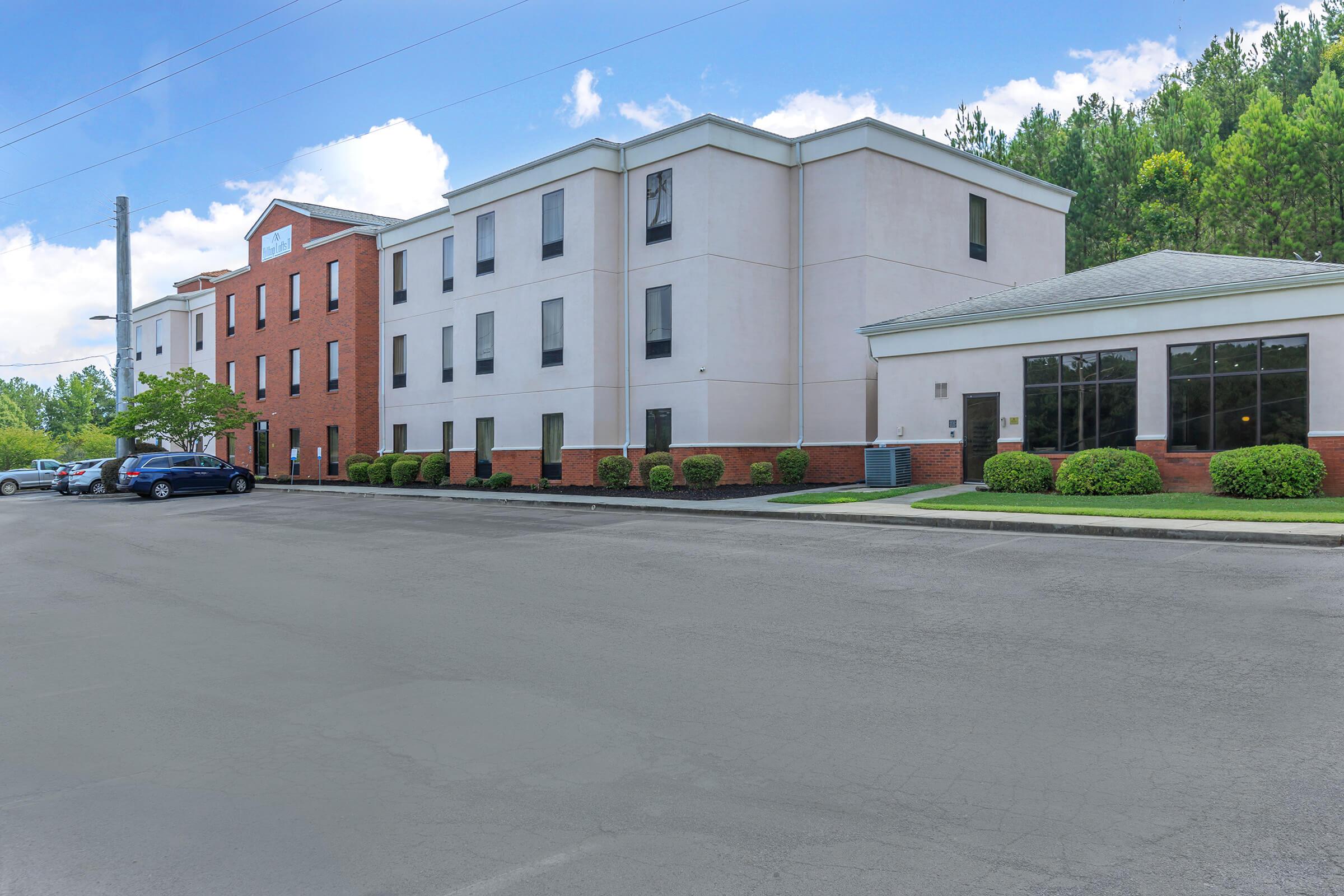 a parking lot next to a building