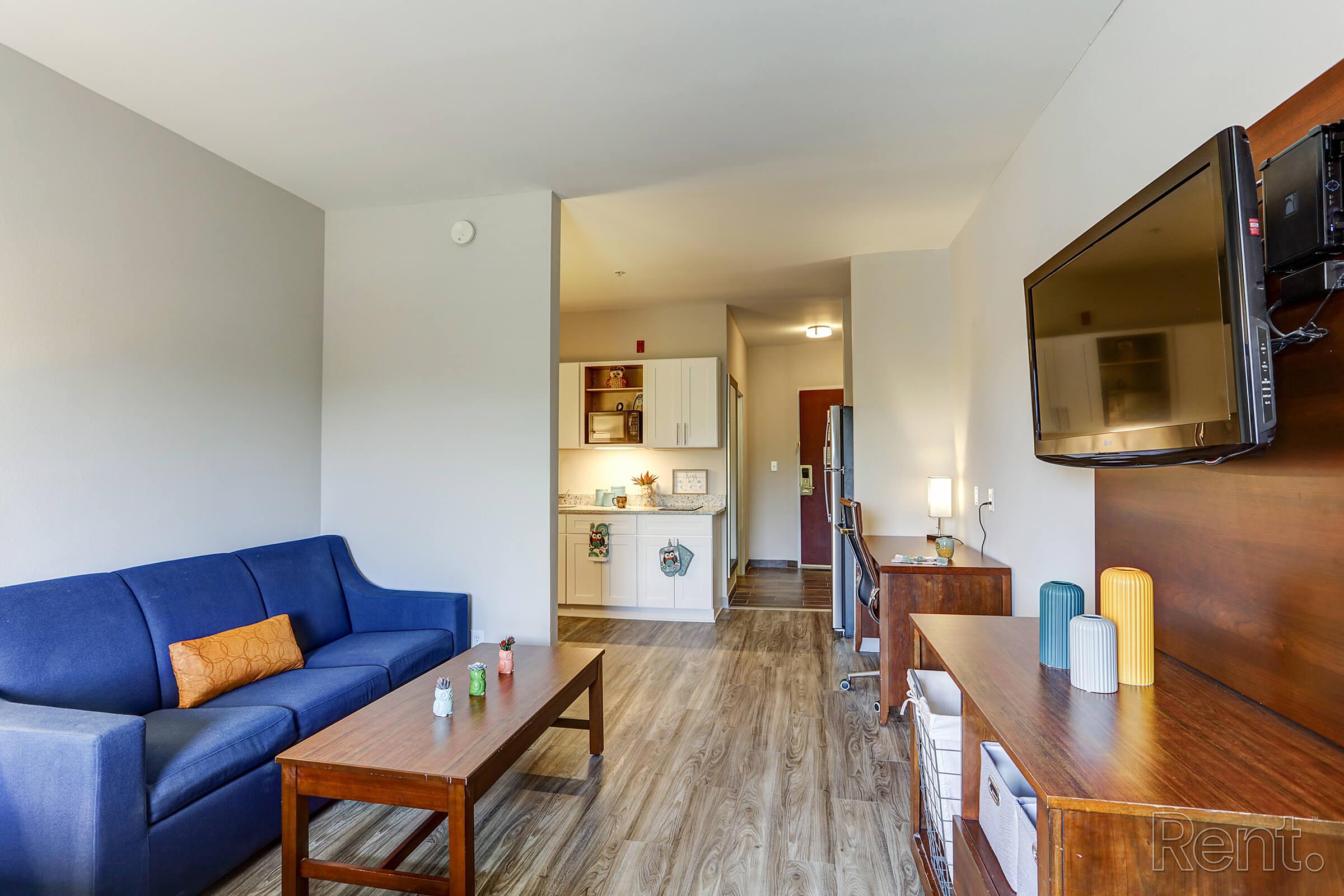 a living room filled with furniture and a table