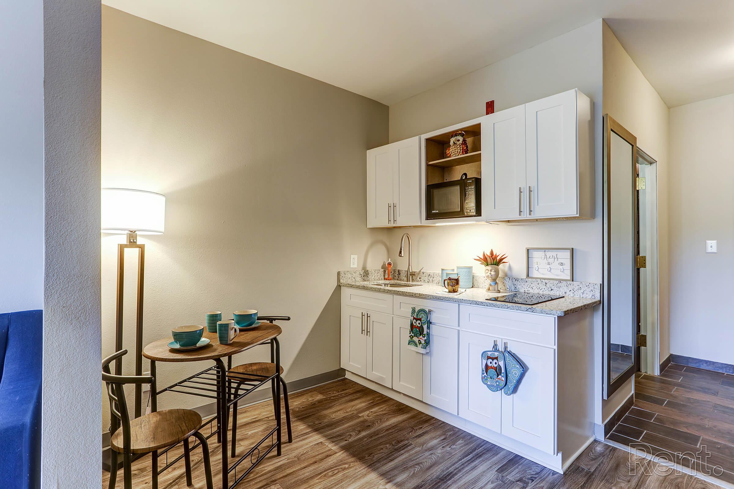 a kitchen with a table in a room