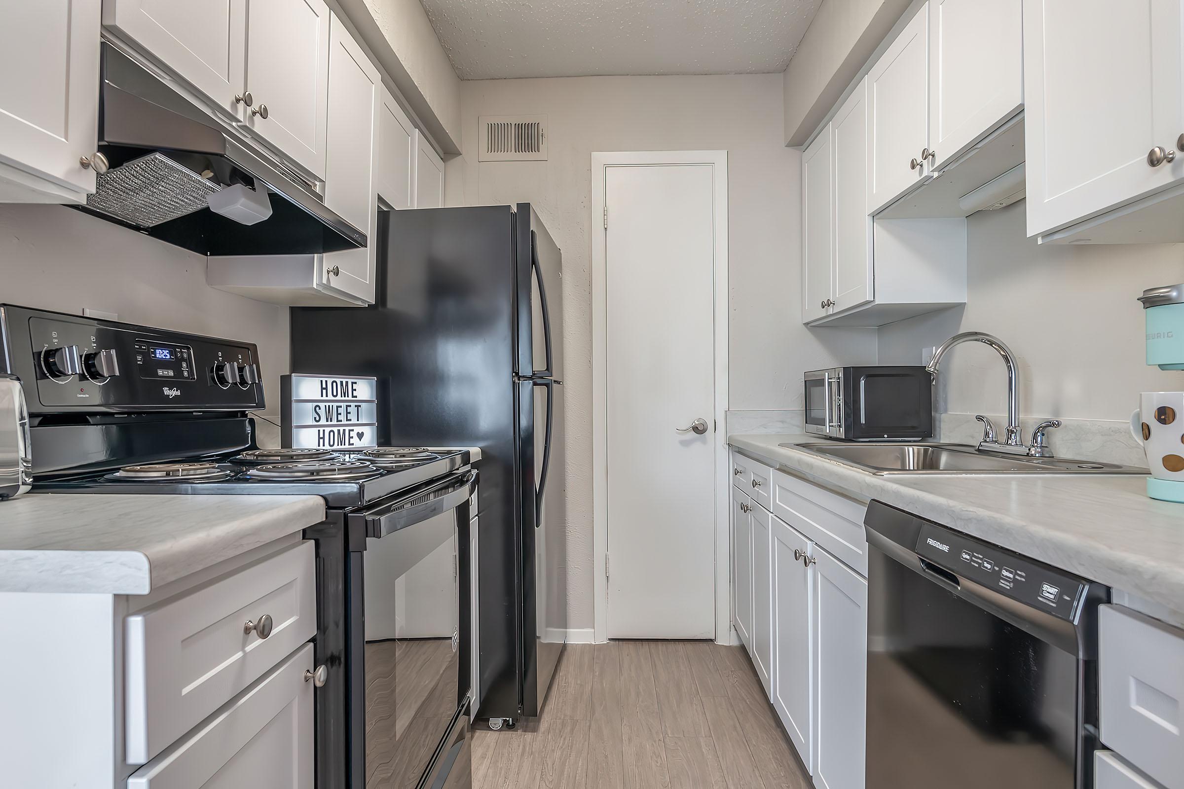 a kitchen with a stove top oven