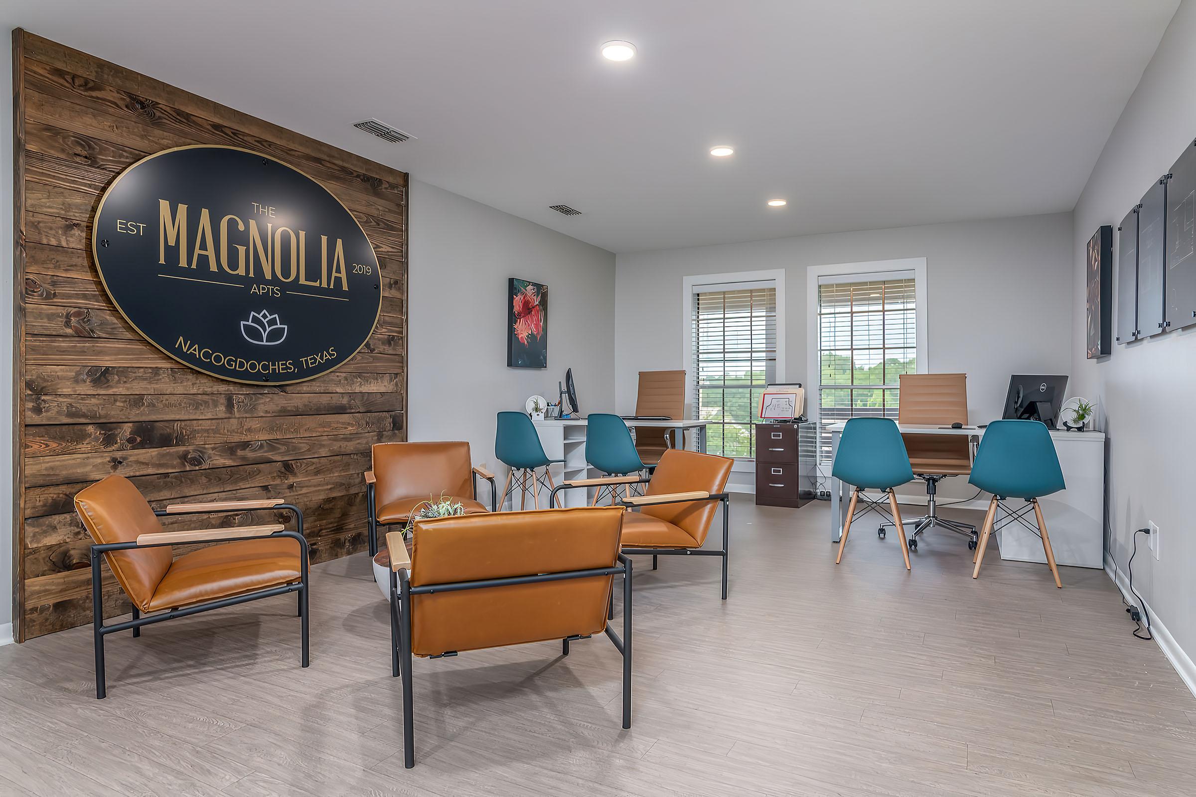 a living room filled with furniture and a table