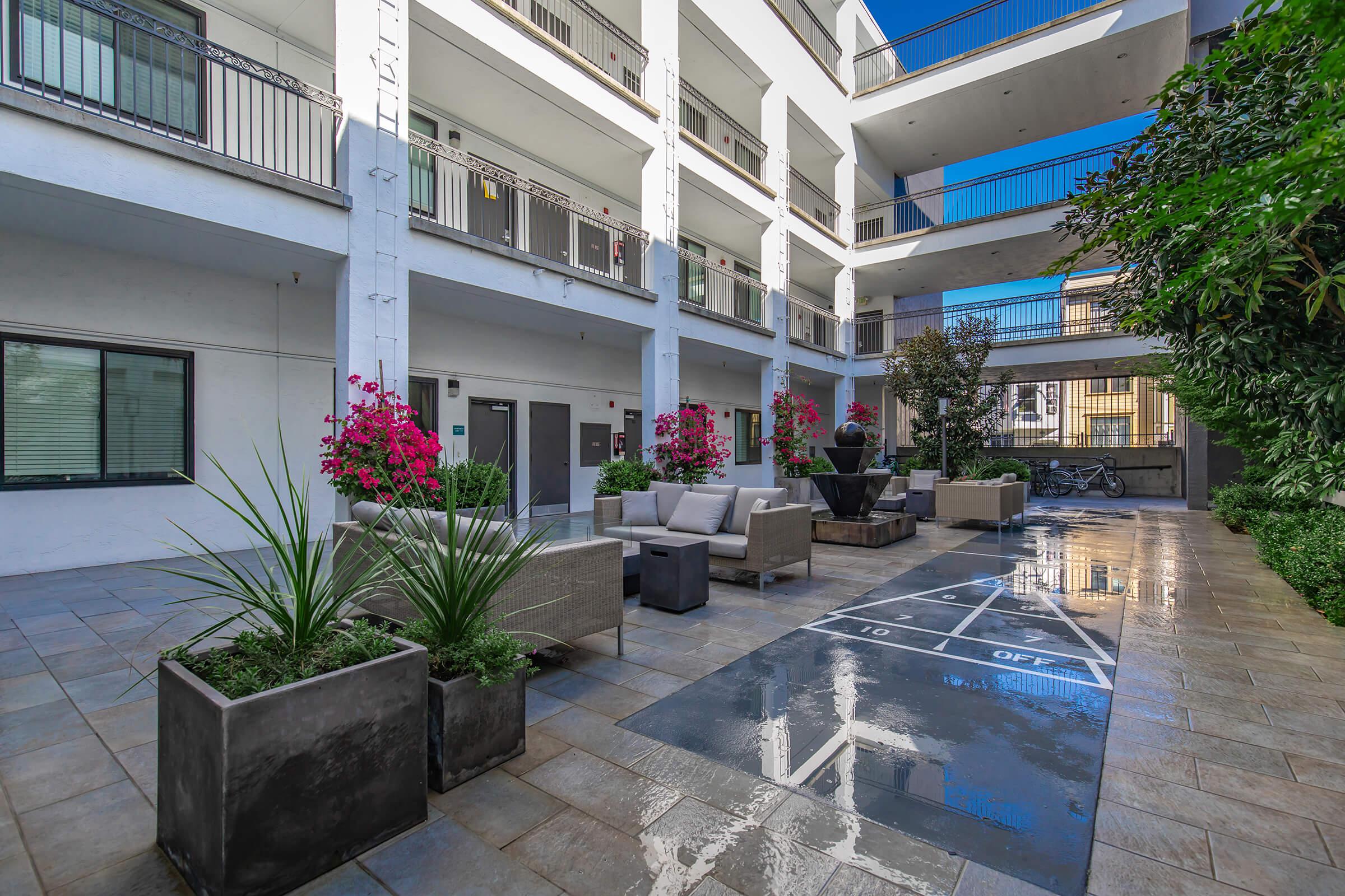 1825 Mission courtyard with shuffleboard