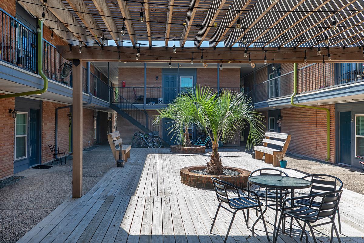 a chair sitting in front of a brick building