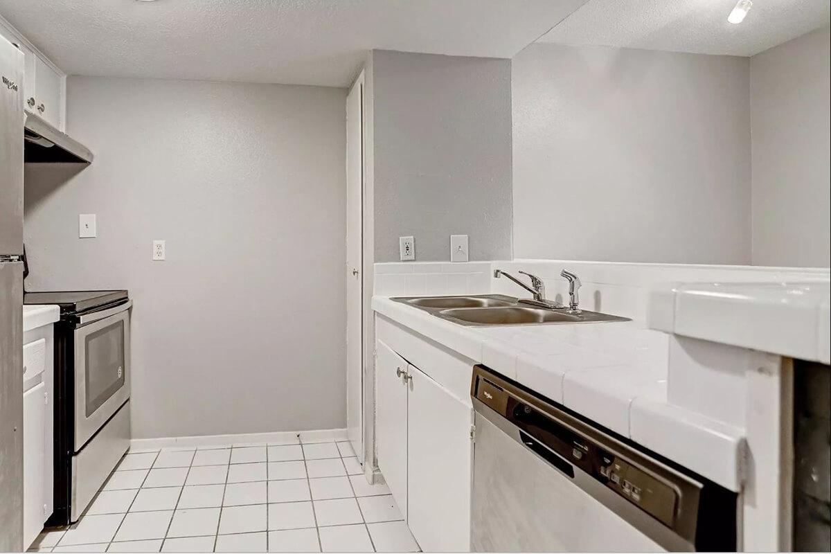 a kitchen with a sink and a microwave