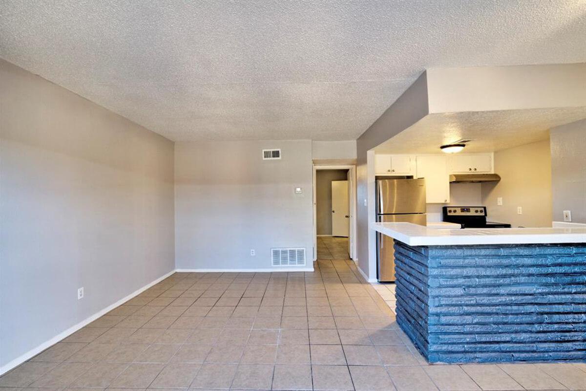 a kitchen area with a building in the background