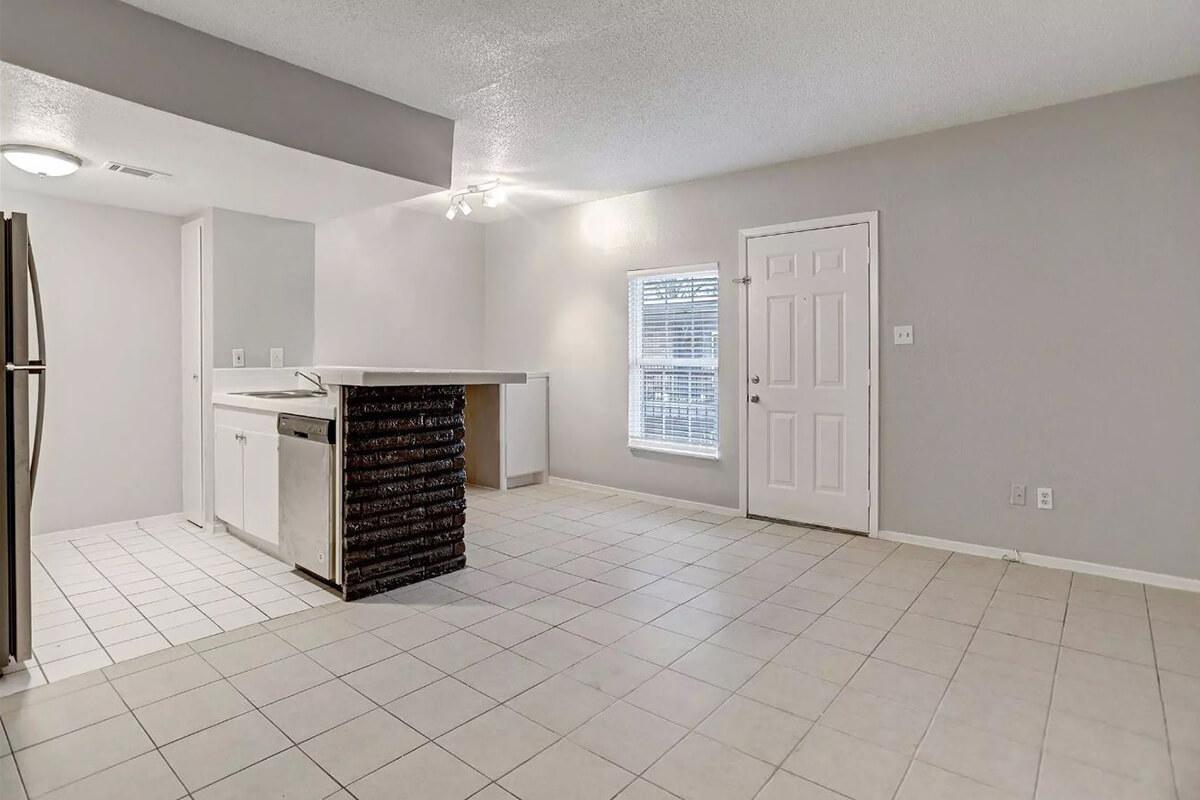 a kitchen with a tile floor