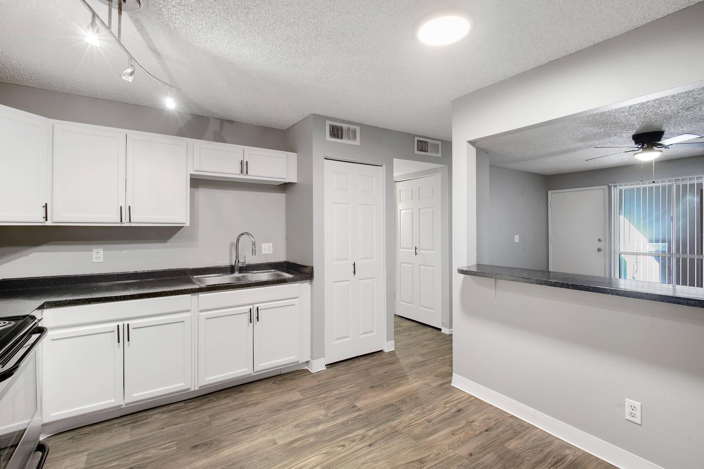 a large kitchen with stainless steel appliances