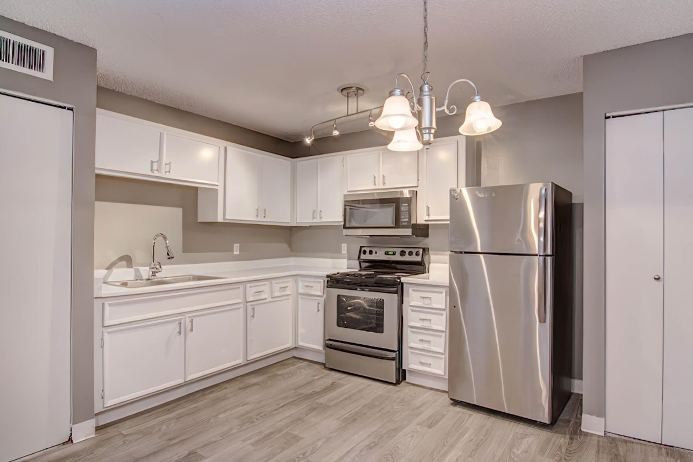 a stainless steel refrigerator in a kitchen