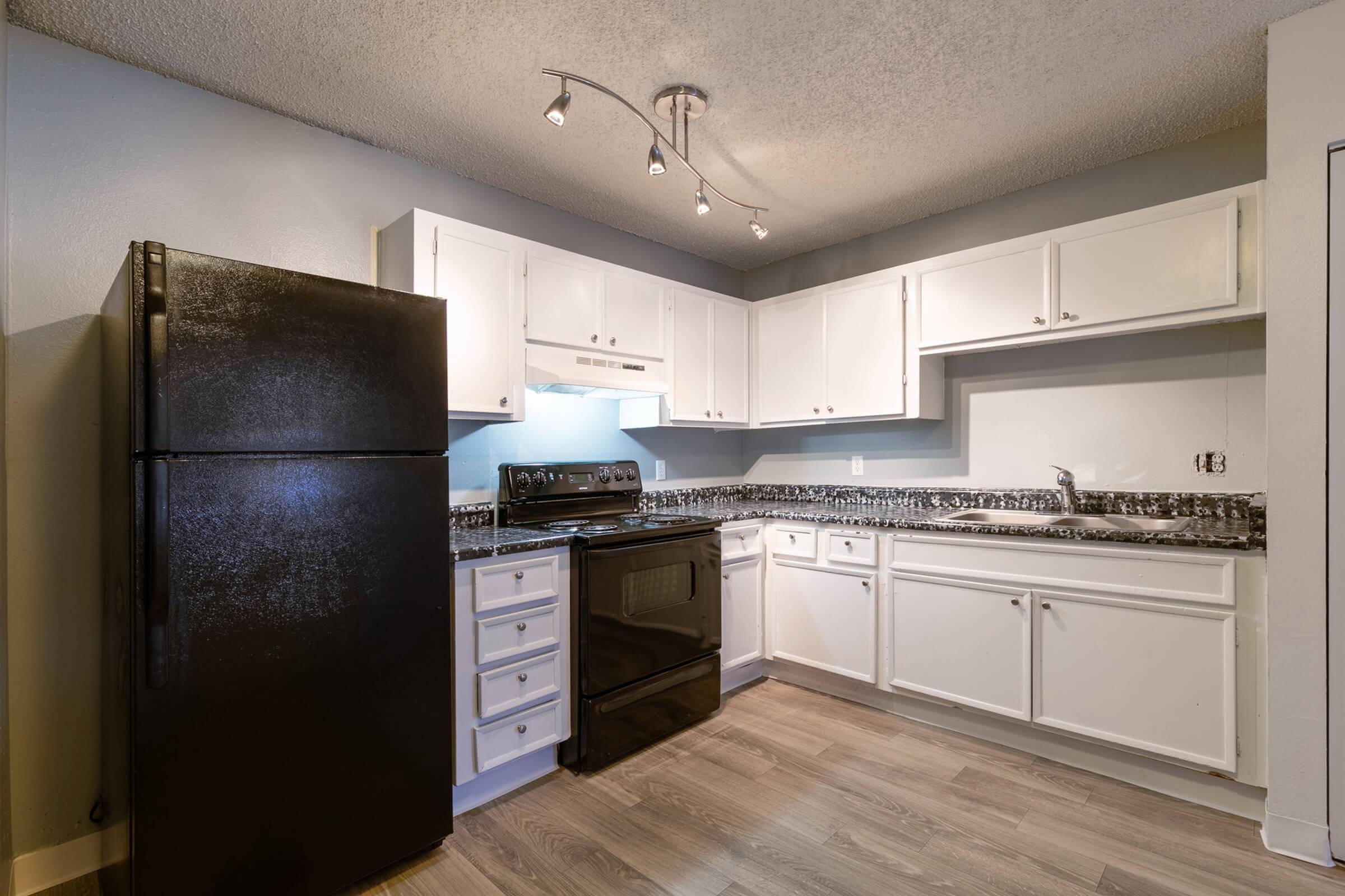 a large kitchen with stainless steel appliances