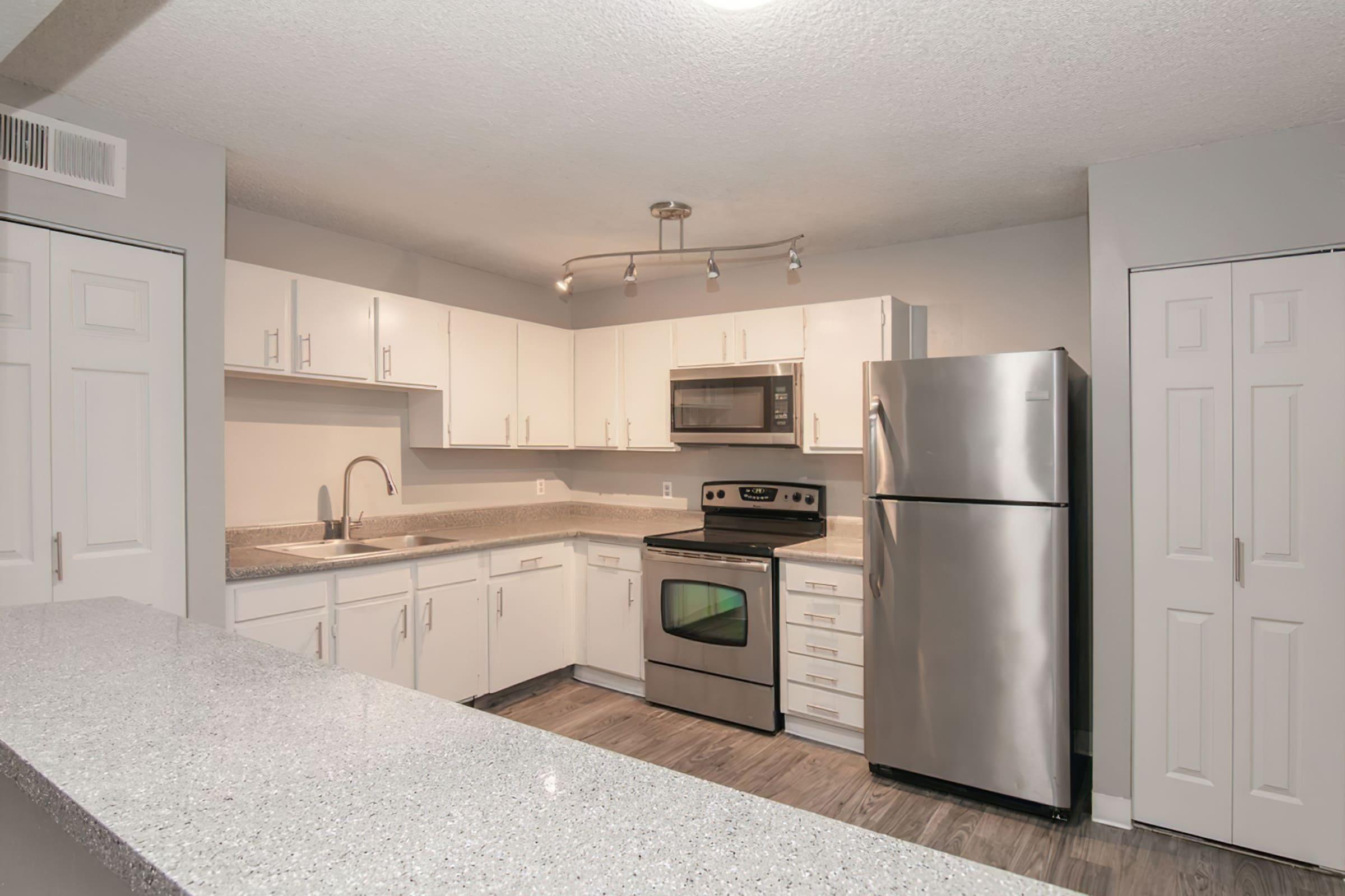 a stainless steel refrigerator in a kitchen