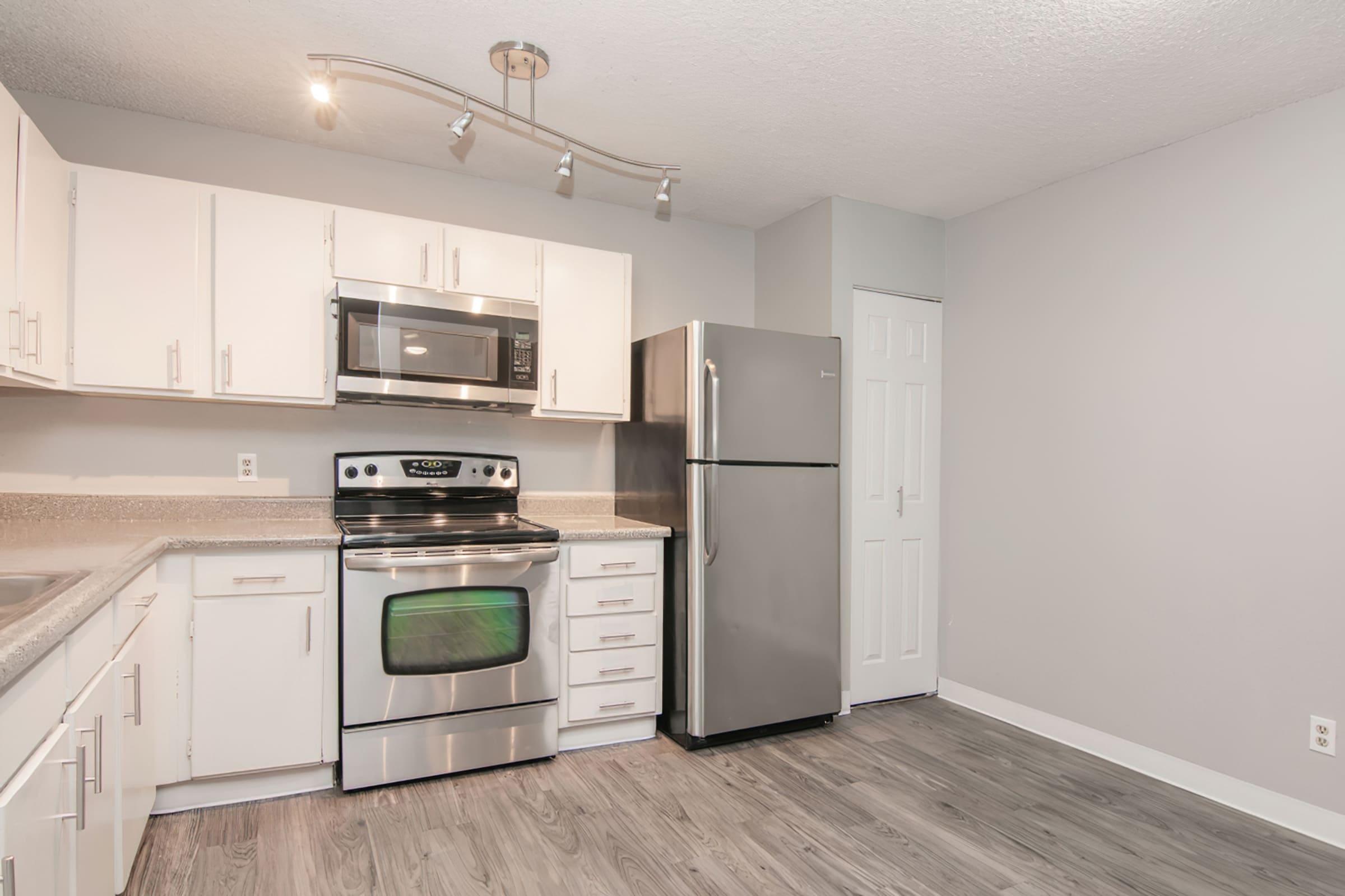 a kitchen with a stove top oven sitting inside of a refrigerator