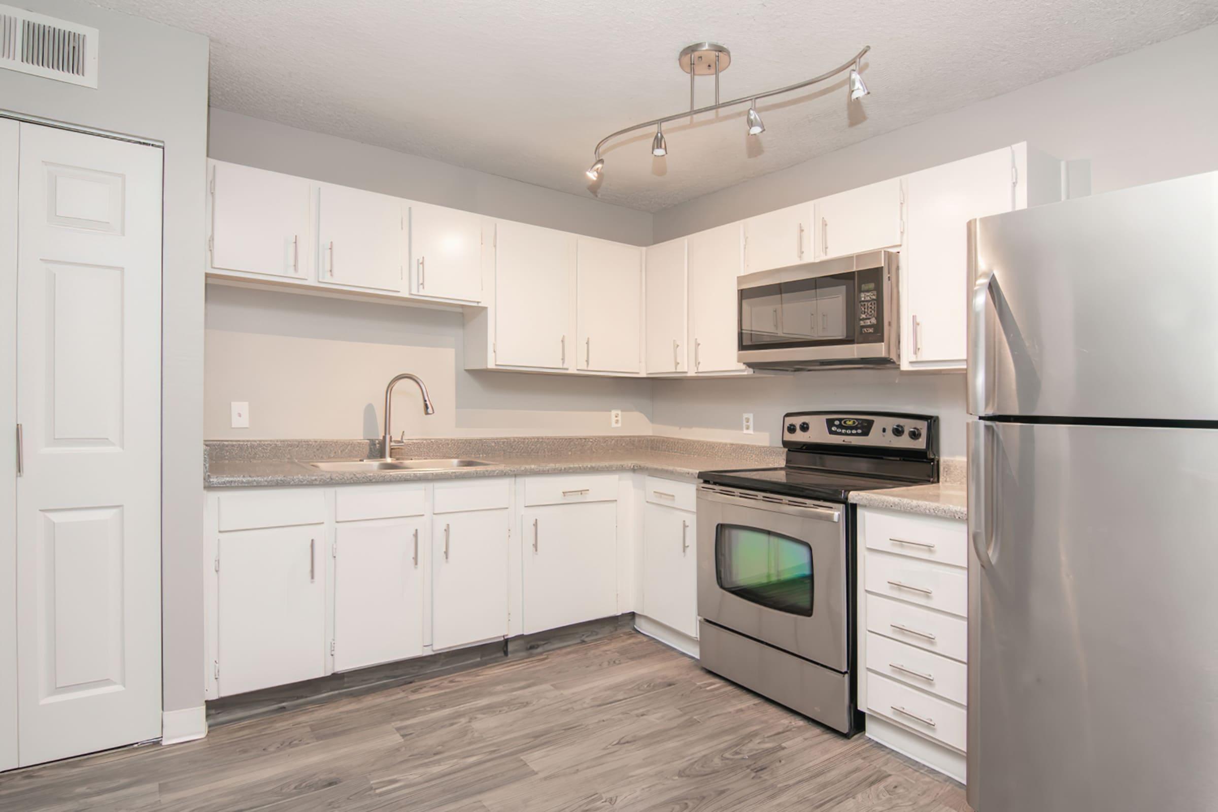 a stainless steel refrigerator in a kitchen