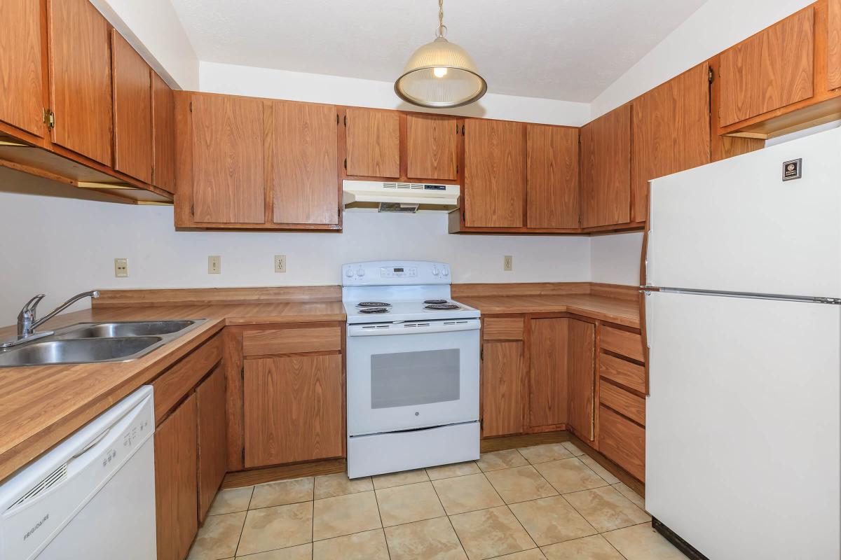 a kitchen with a stove top oven sitting inside of a refrigerator