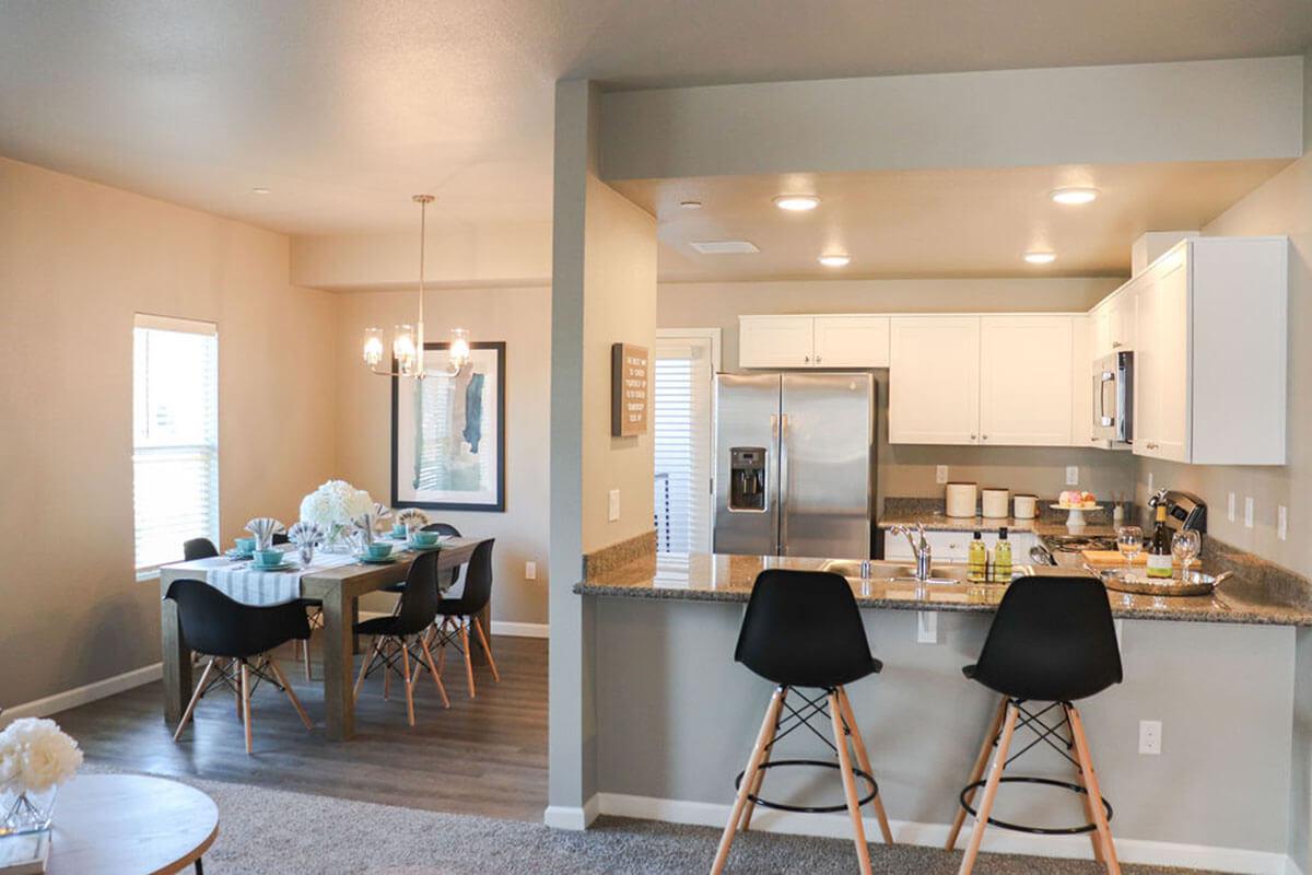 a living room filled with furniture and a table