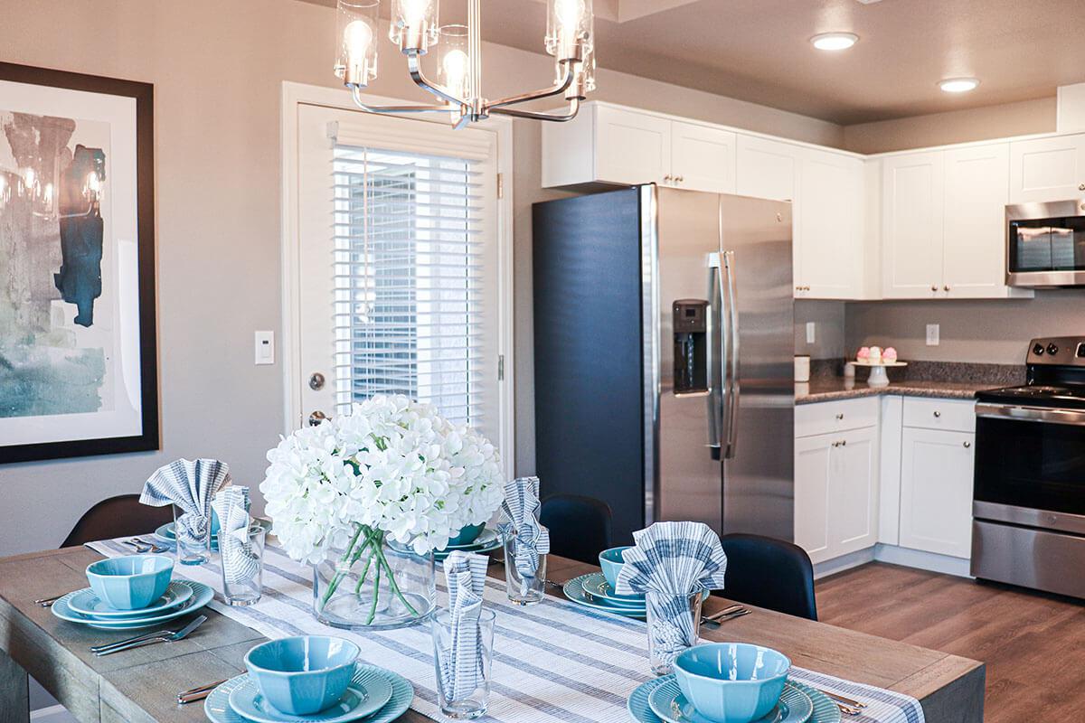 a kitchen with a dining table