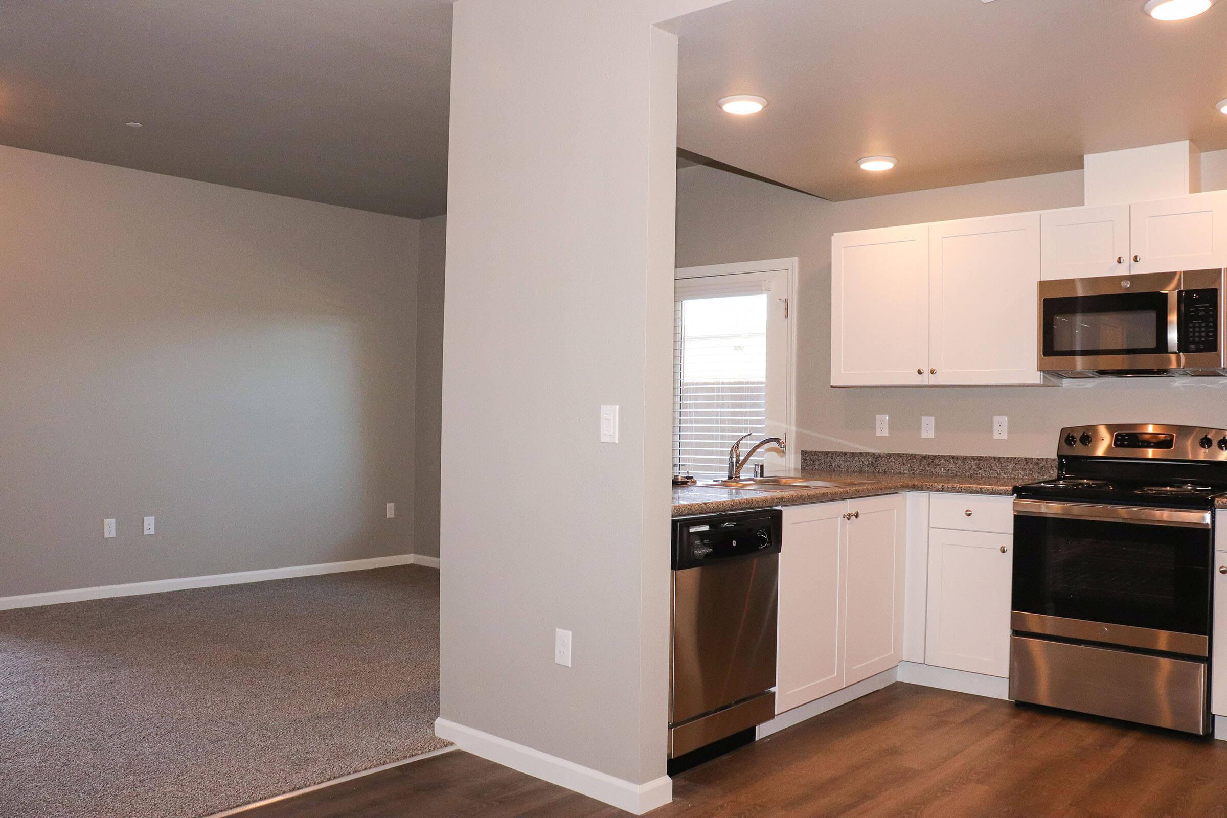 a kitchen with a stove and a refrigerator