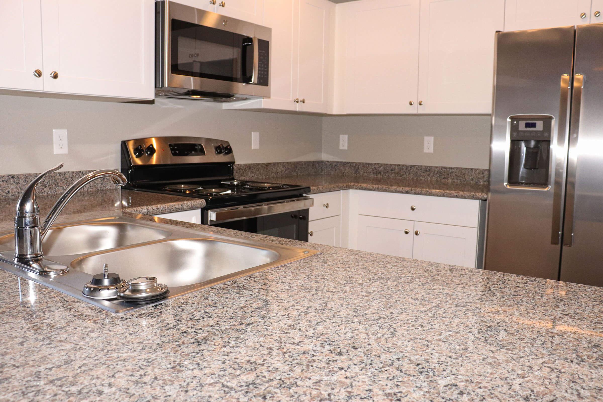 a modern kitchen with stainless steel appliances