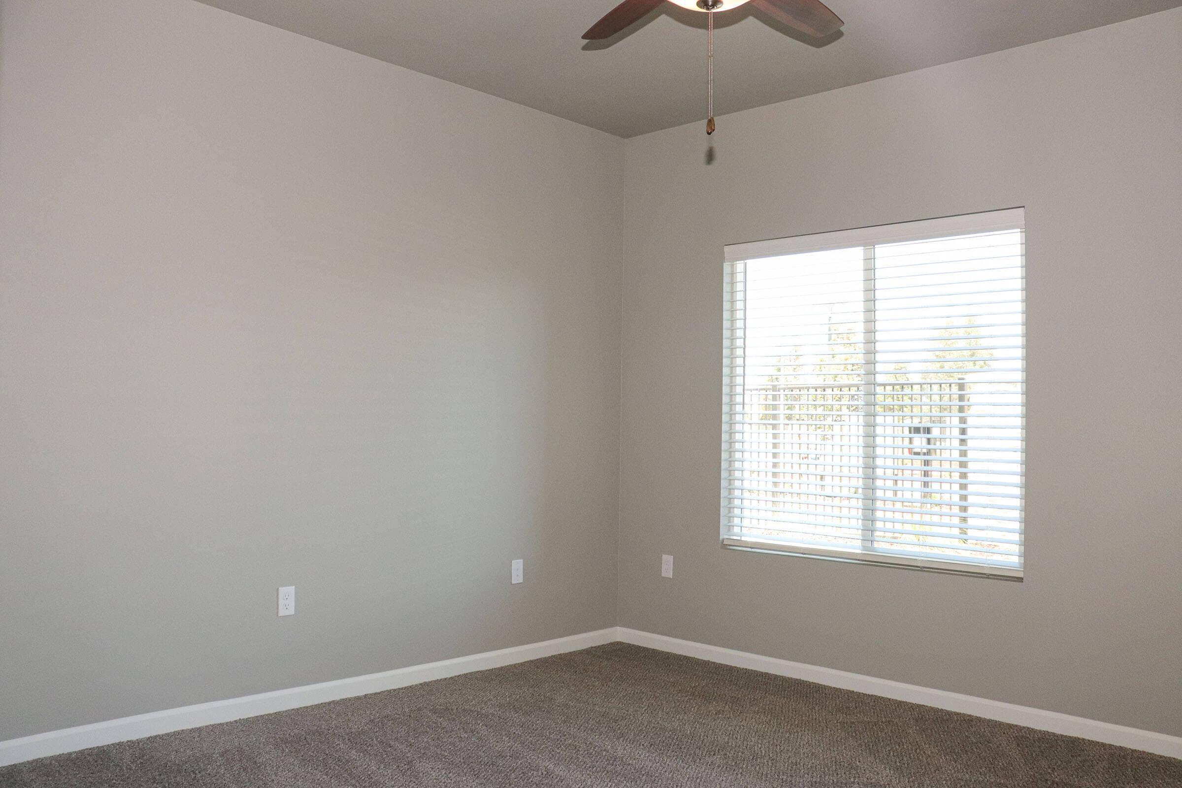 a bedroom with a large window