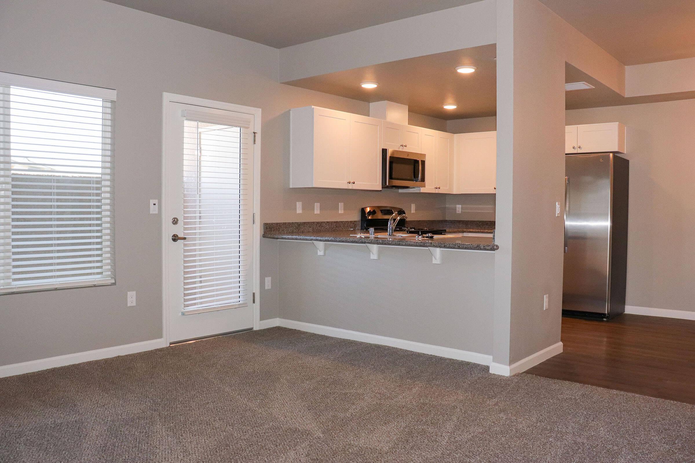 a kitchen with a sink and a window